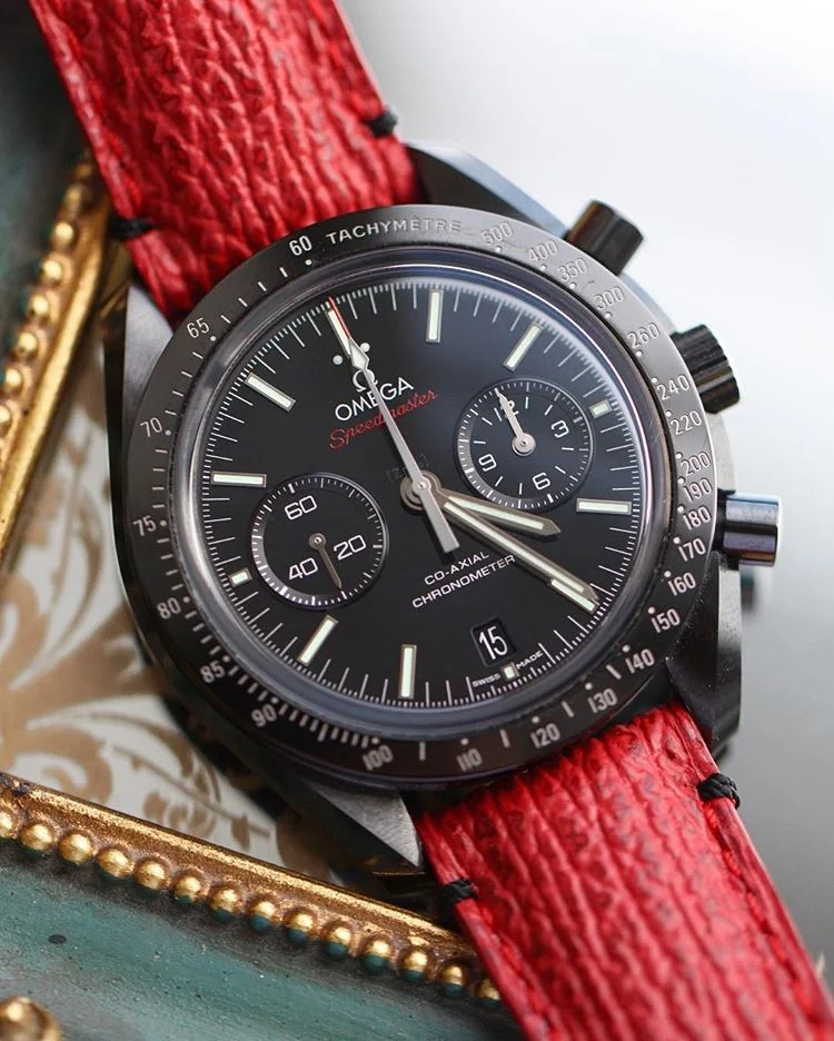 Omega DSOTM Speedmaster on red shark with black stitching