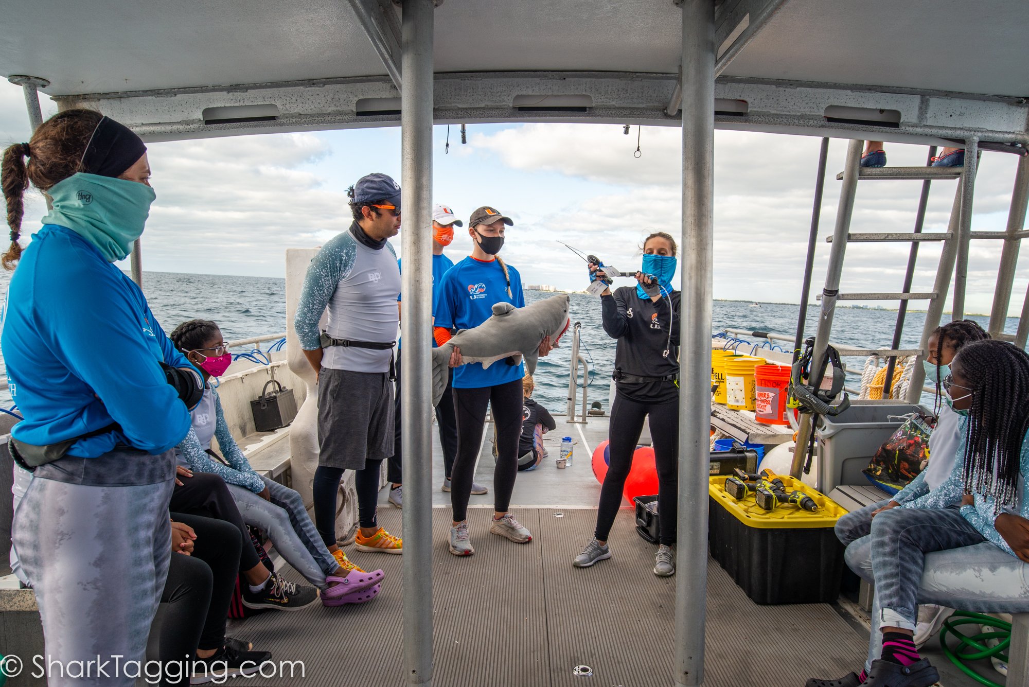 SRC graduate student discusses the types of satellite tags that will be used on the expedition. 