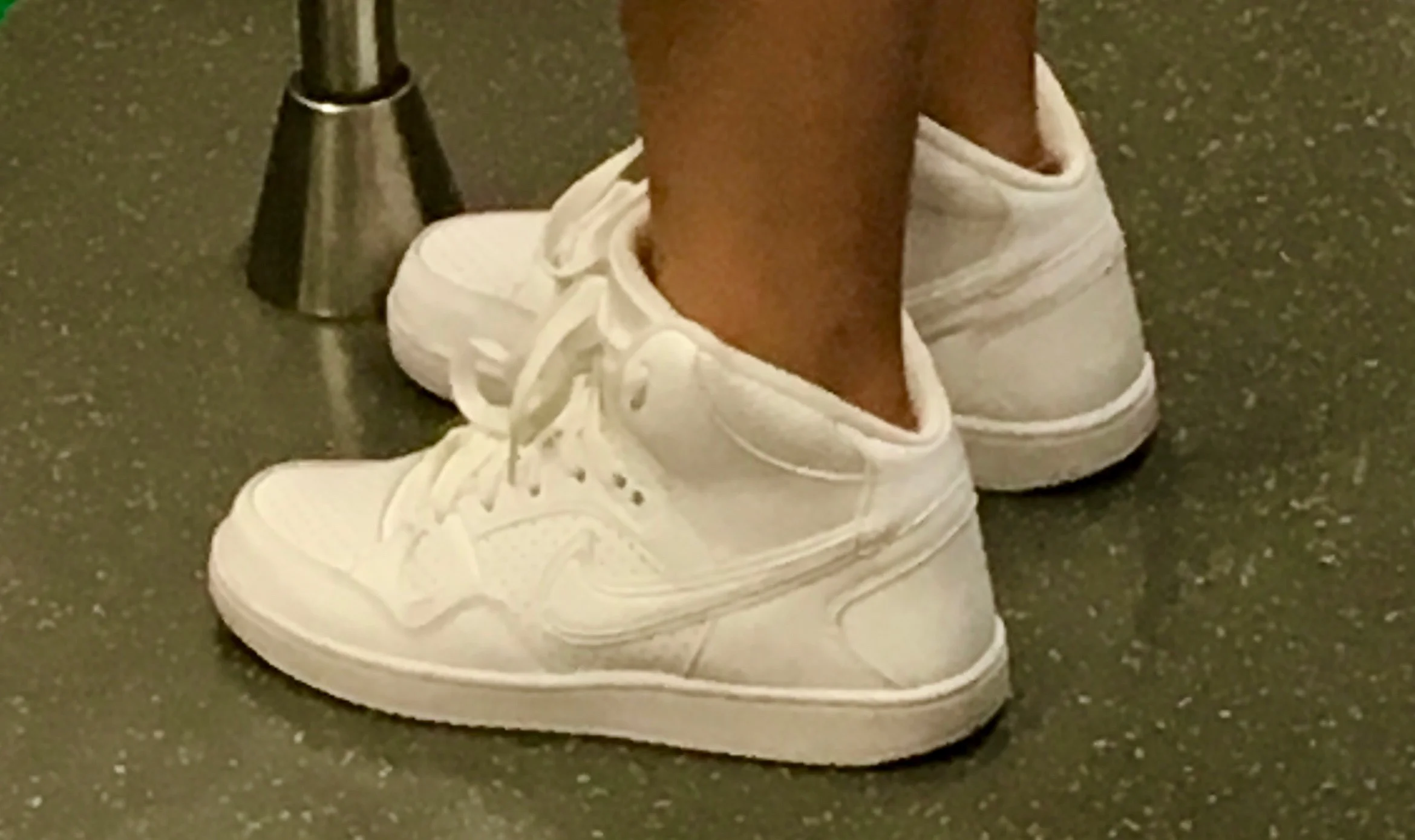 Someone is trying really hard to make a fake less obvious on this one, a subtle double swoosh, but the last and sole are off too. Nice try!