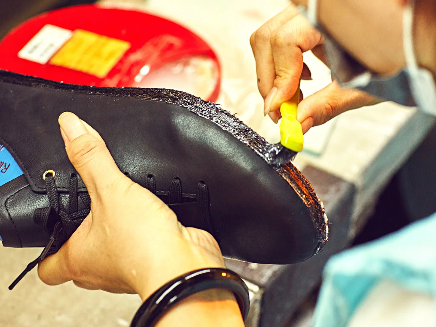 Step 4.1: Cementing A layer of cement is applied to the area where upper meets bottom with precision.