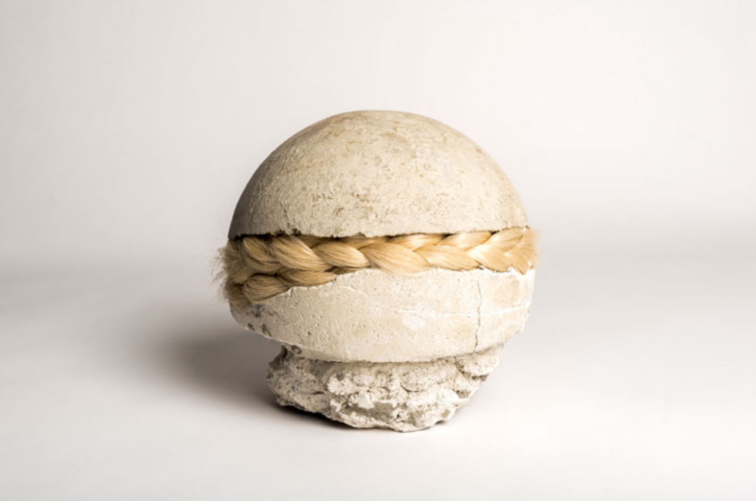 Veronica A Pérez, wrecking ball , mortar, hair, 15 x 7 inches, 2016.