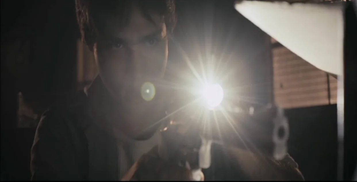 kid with gun still.jpg