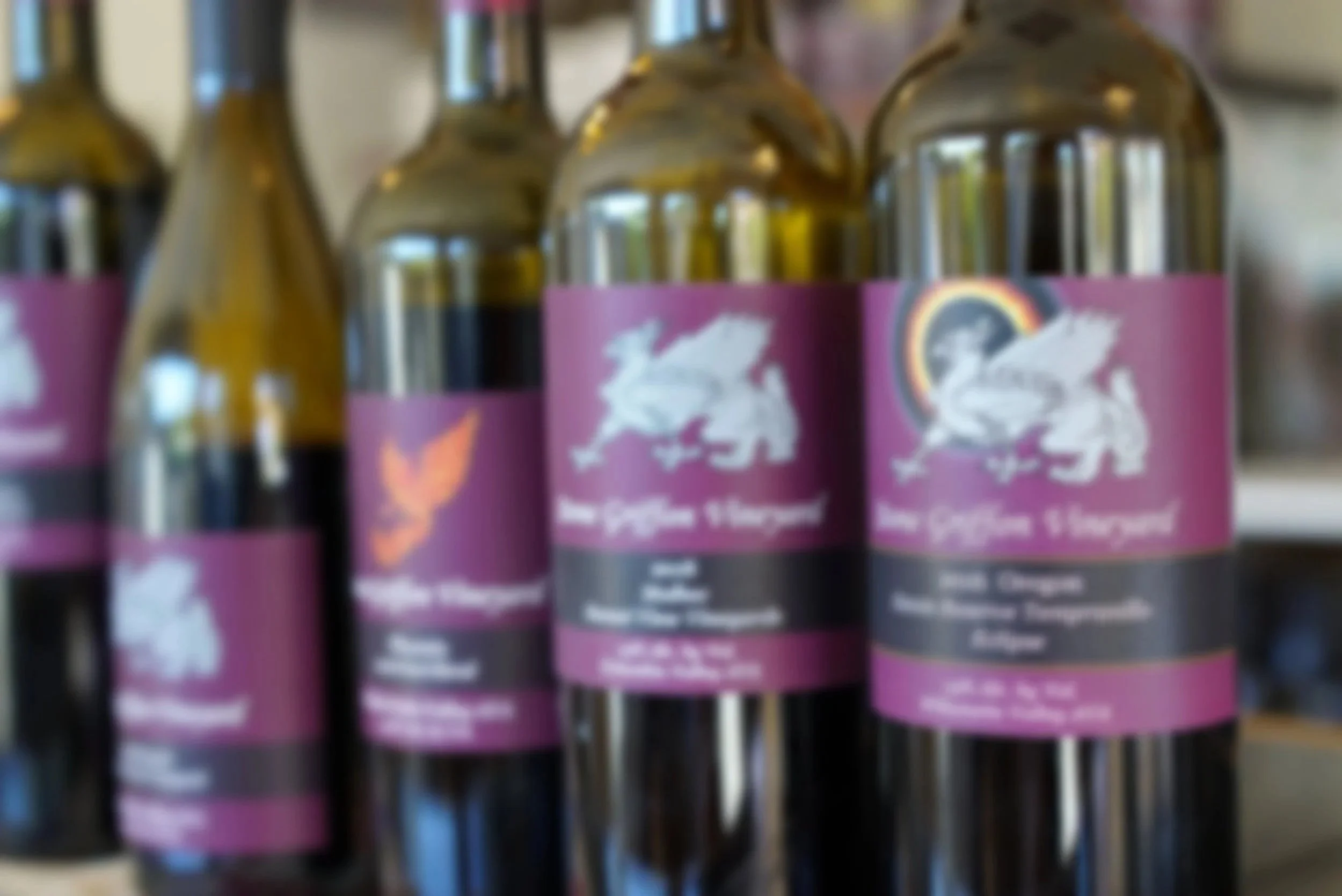 Lineup of Stone Griffon wine bottles