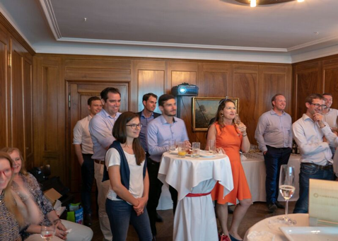 as they listen to host Áine Ní Mhuiris’ welcoming speech