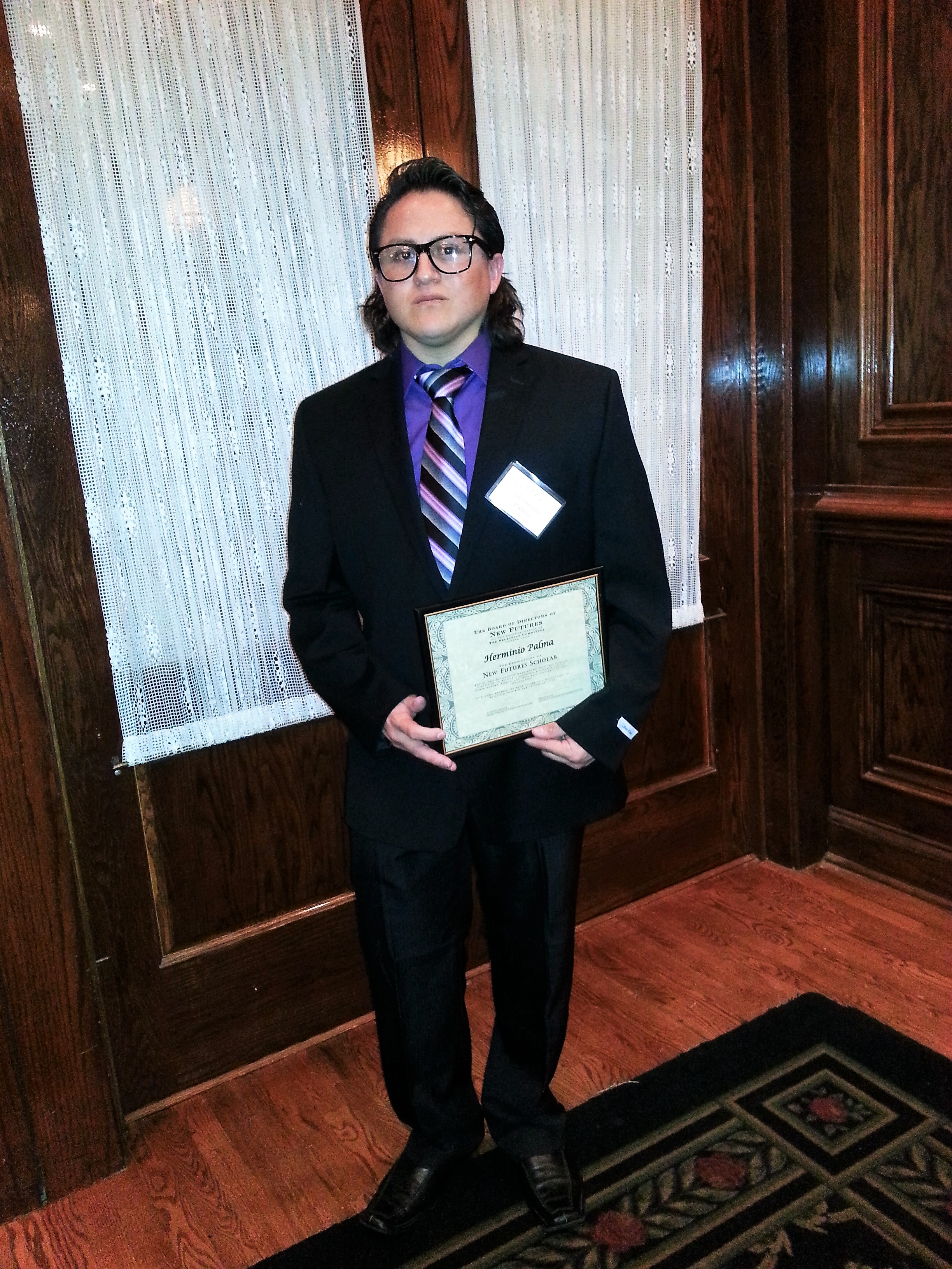 Herminio, receiving the New Futures Scholarship, December 2013