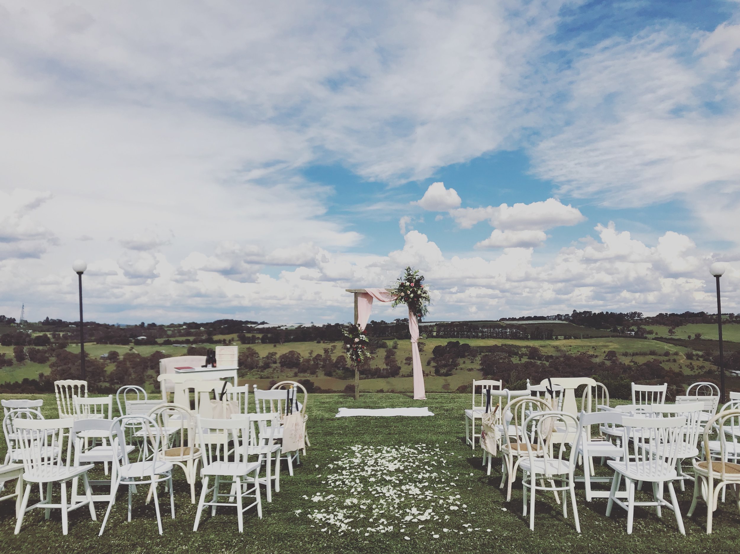 White Eclectic Chairs // Photo by Bespoke Country Weddings