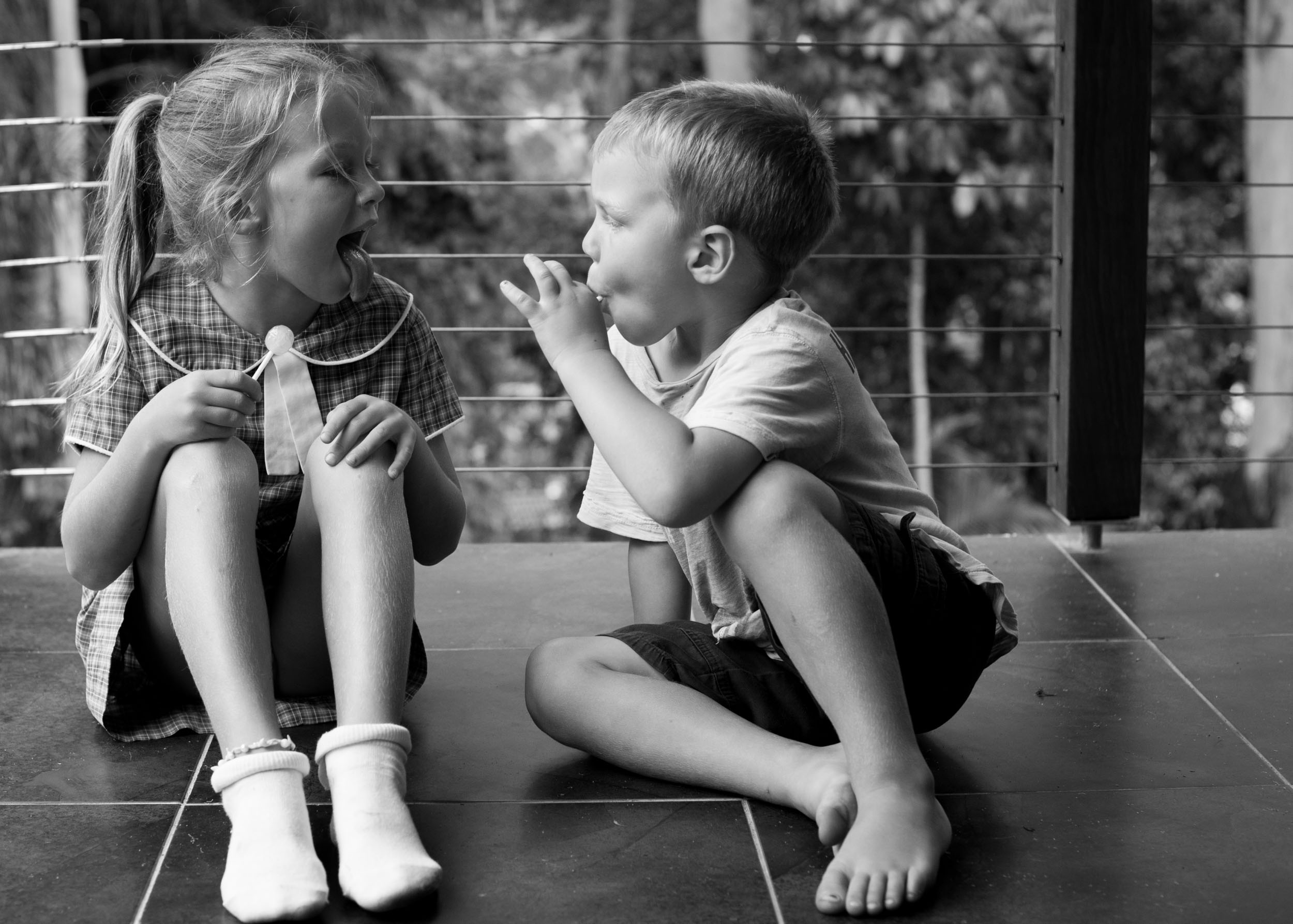 Kids sucking on lolly pops