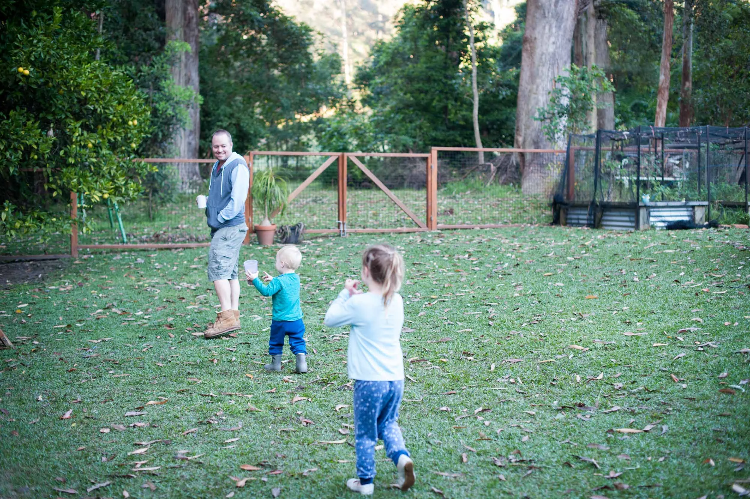 Family walking in back yard