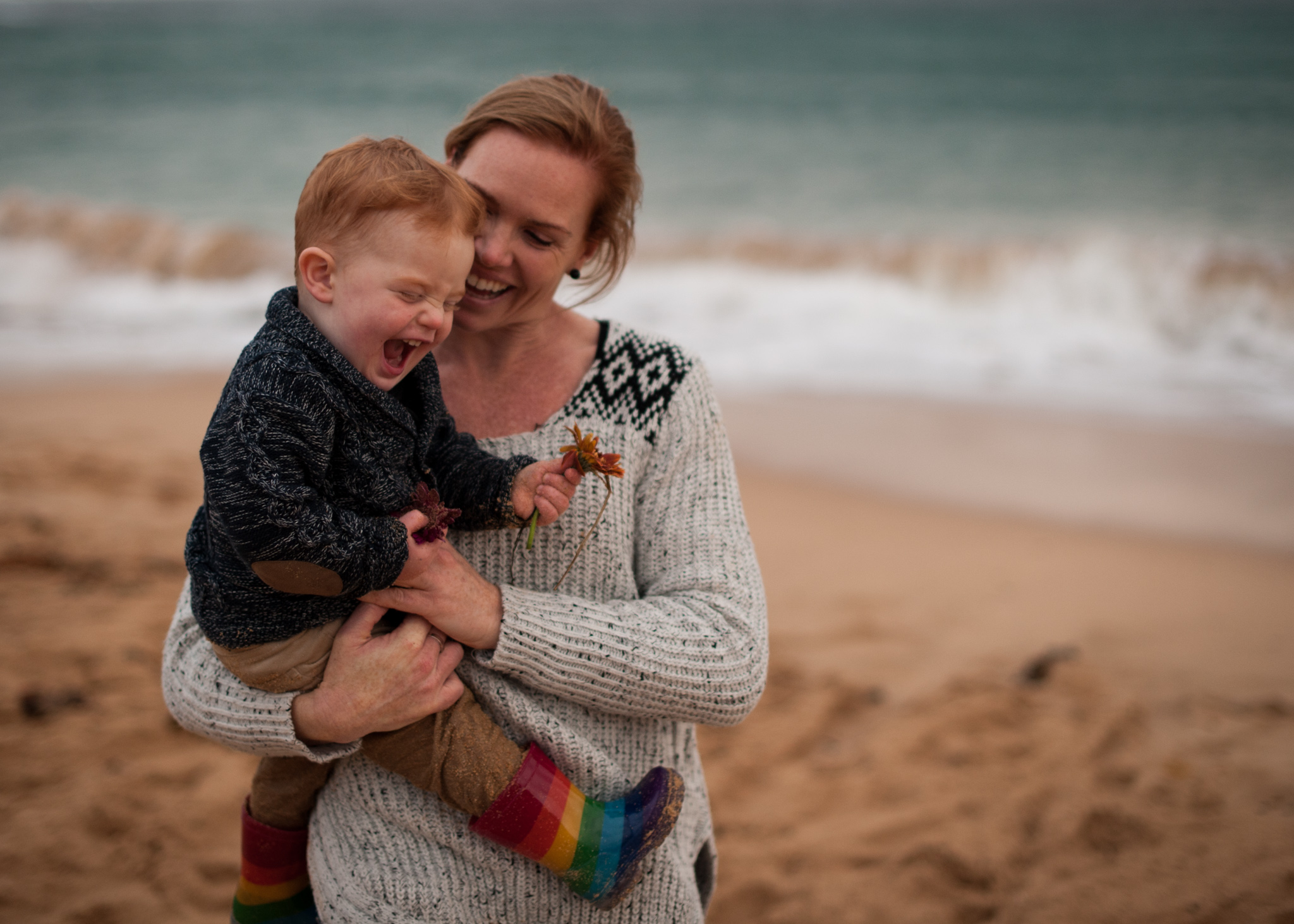 Tickles with mummy at the beach