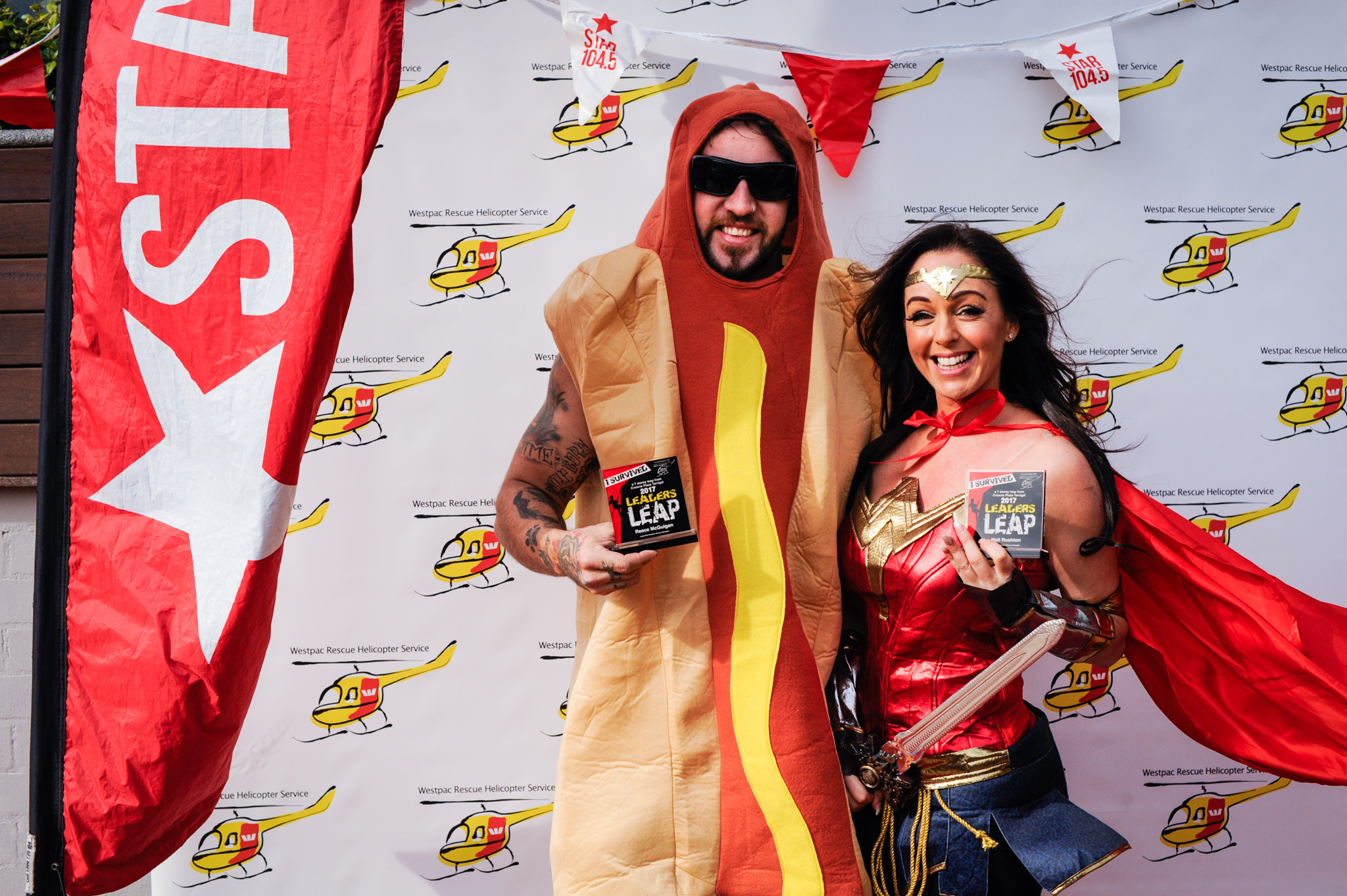 Reece the Hot Dog and Wonder woman after abseiling for Westpac Rescue Helicopter