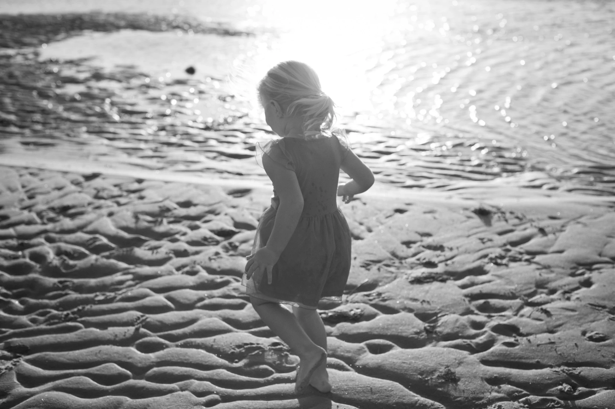 central coast family photographer little girl running through the water