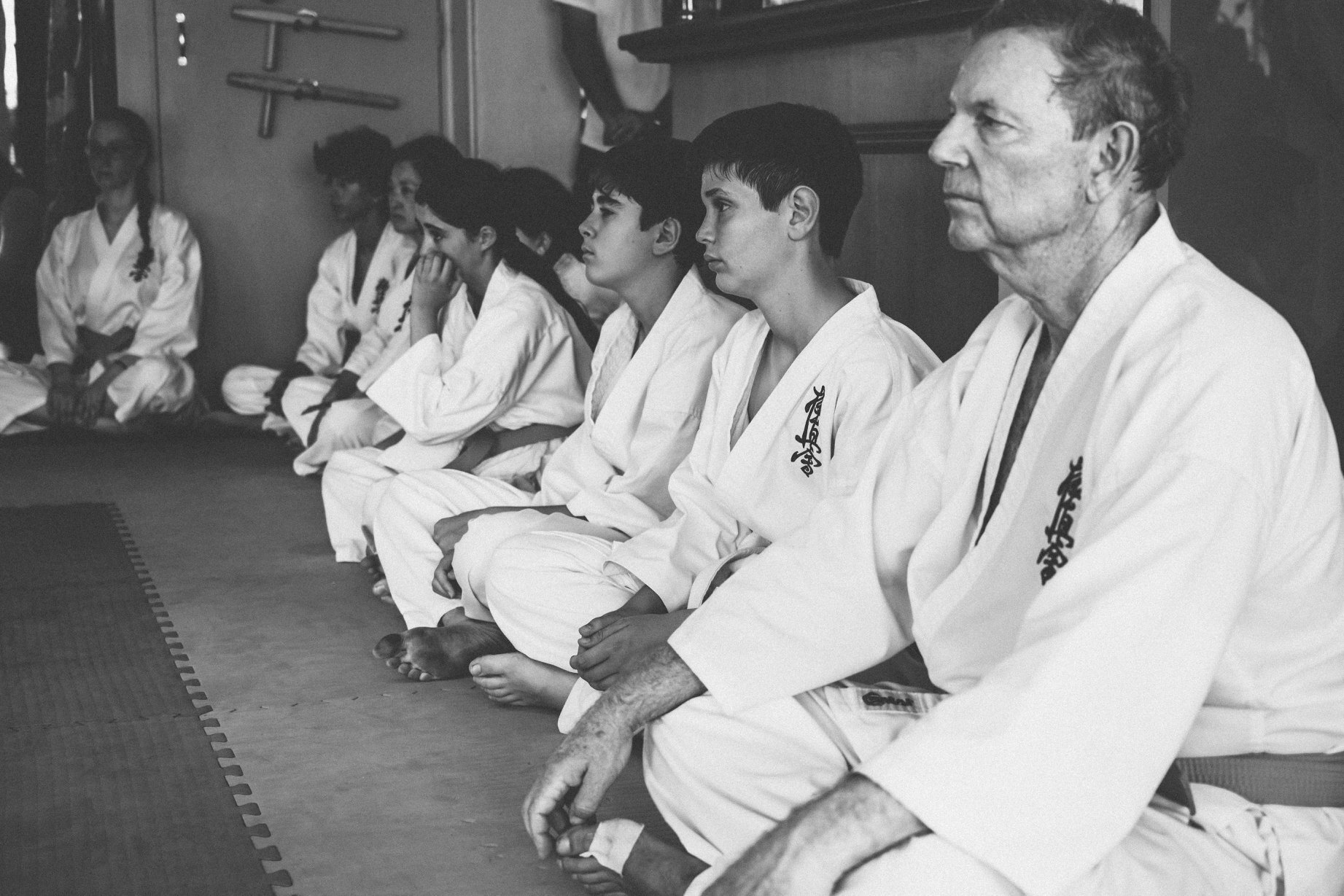 white and orange belts sitting back.jpg