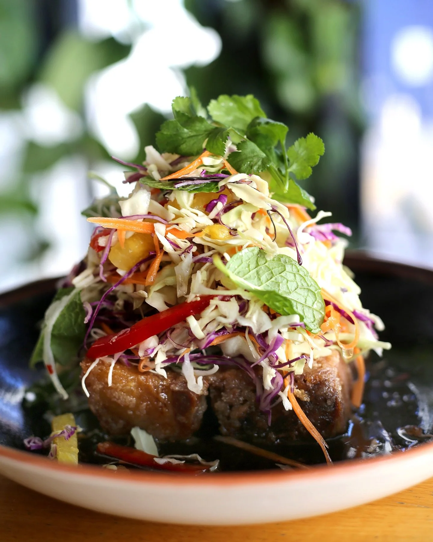 Up close and personal with our Twice Cooked Crispy Pork Belly, tamarind chilli caramel, pineapple and fragrant herb salad 🍍