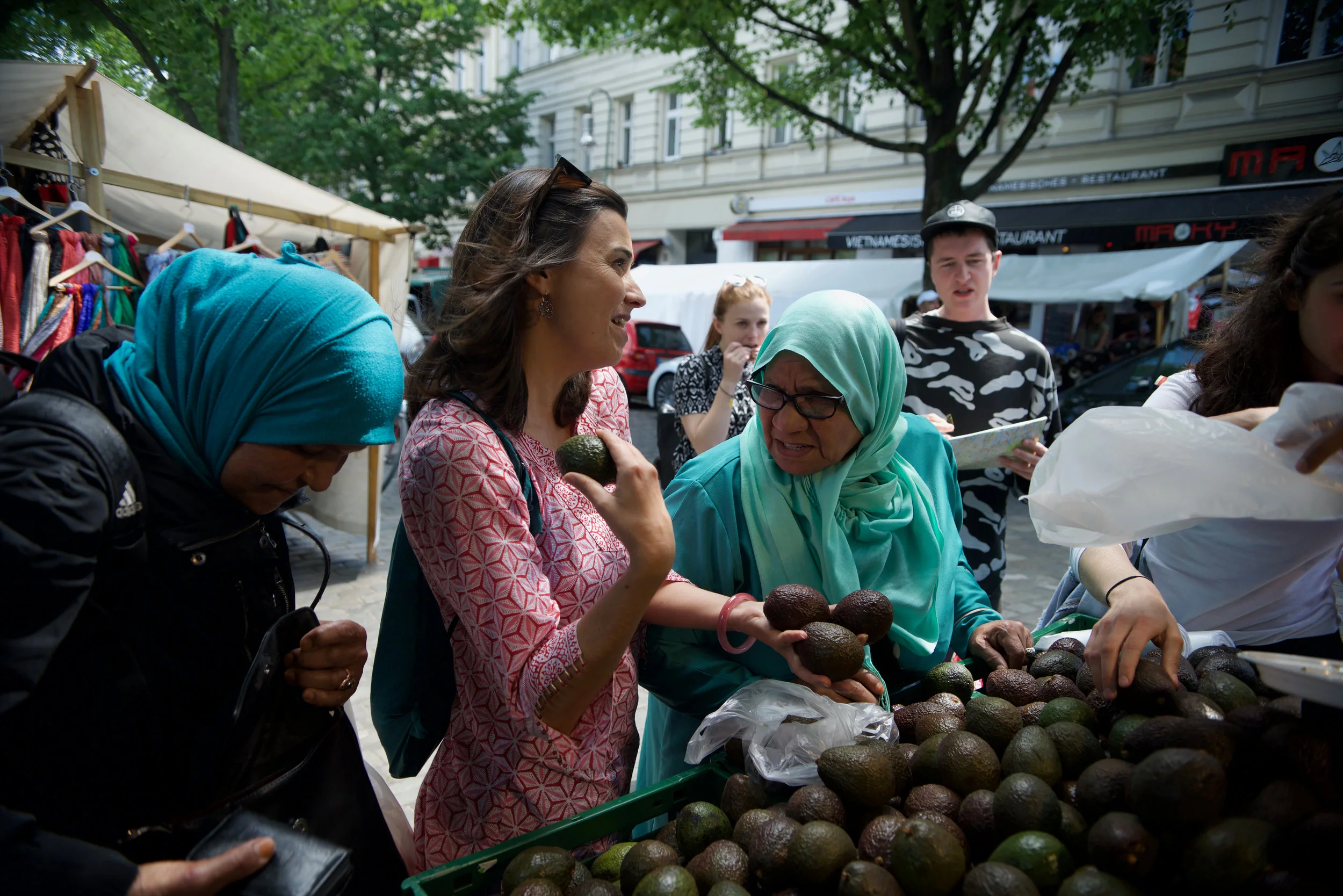 Selecting avocados at a Turkish market.