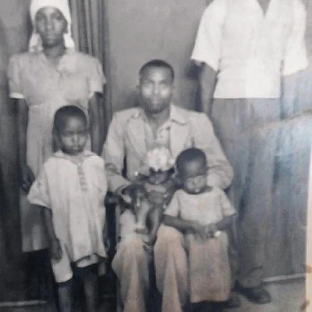 Figure 1: My grandfather holding my dad who was a few months old. Standing beside is my grandmother and in front is my Uncle Stephen and Aunty Lucy.