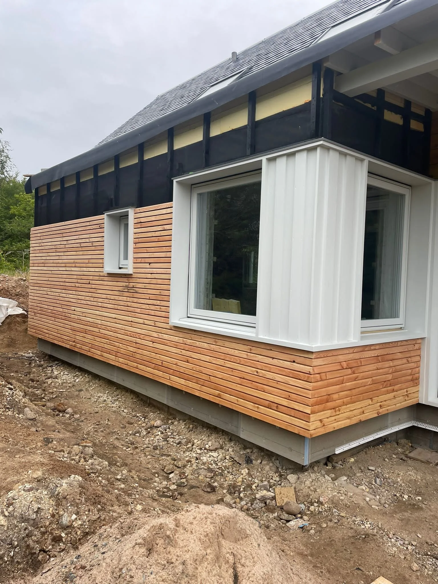 Rainscreen Cladding in progress.JPG