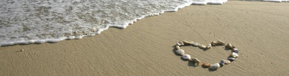 heart-shape-shells-beach-sea-waves.jpg
