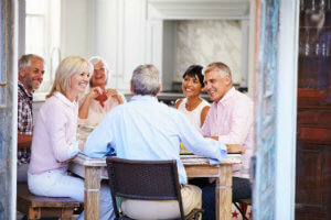 people-sitting-table-conversing-smiling.jpg