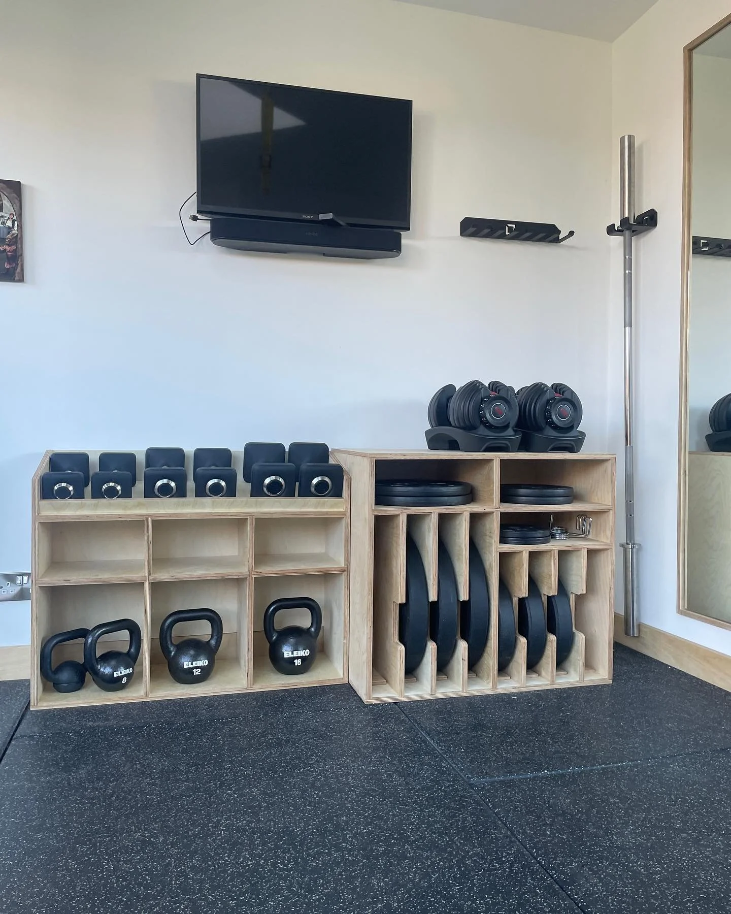 This time around we were tasked sorting storage to bring together various plates, dumbbells and kettlebells, freeing back up some floor space. 

These bespoke birch ply units complement our original peg boards, and the various reveals and skirting de