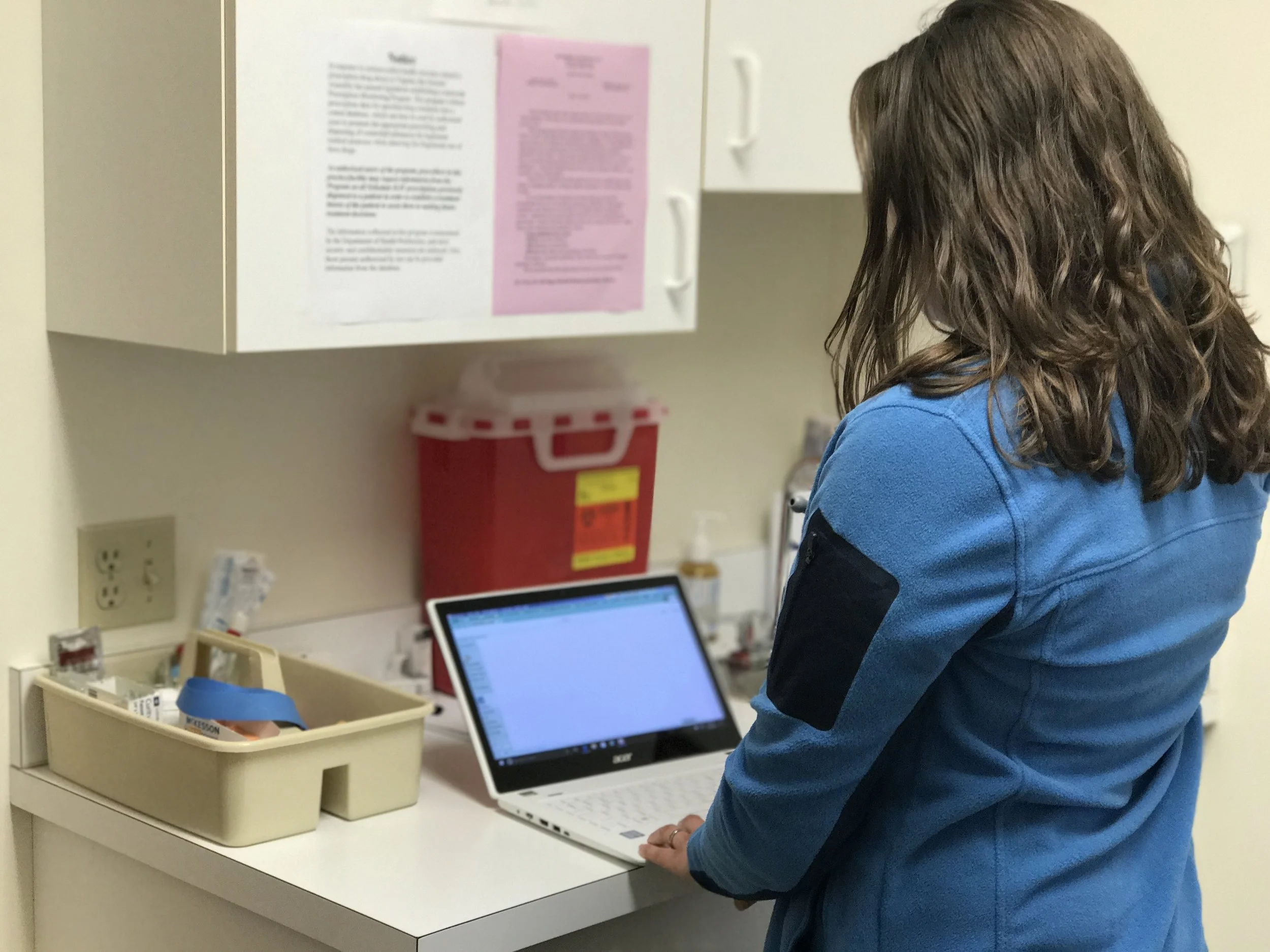 Emily Long, nurse practitioner at Rockbridge Internists, enters patient data in an electronic health system.