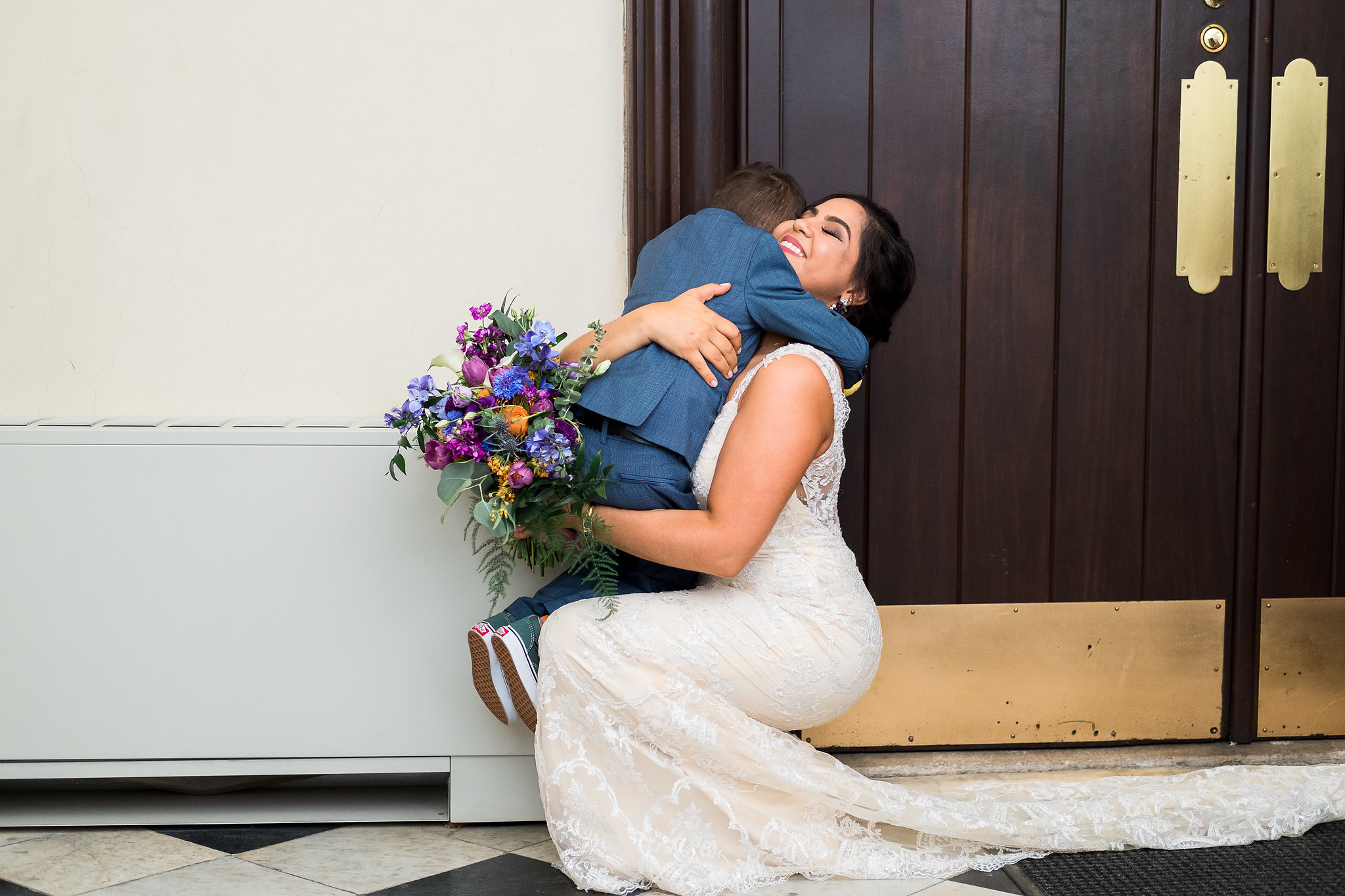 Bride with son before wedding ceremony