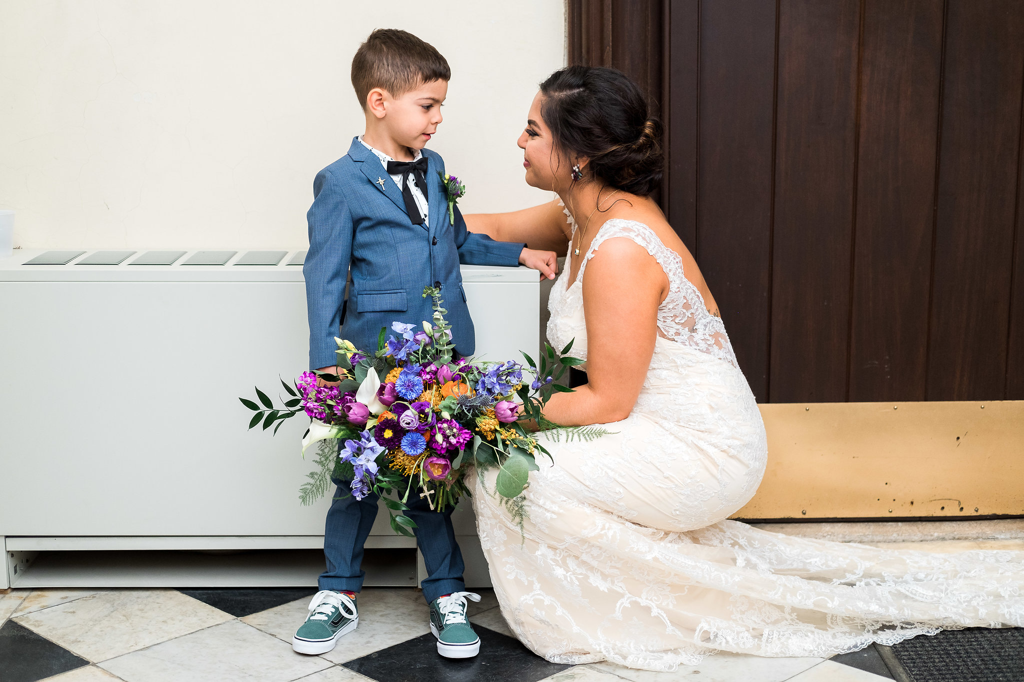 Bride with son before wedding ceremony