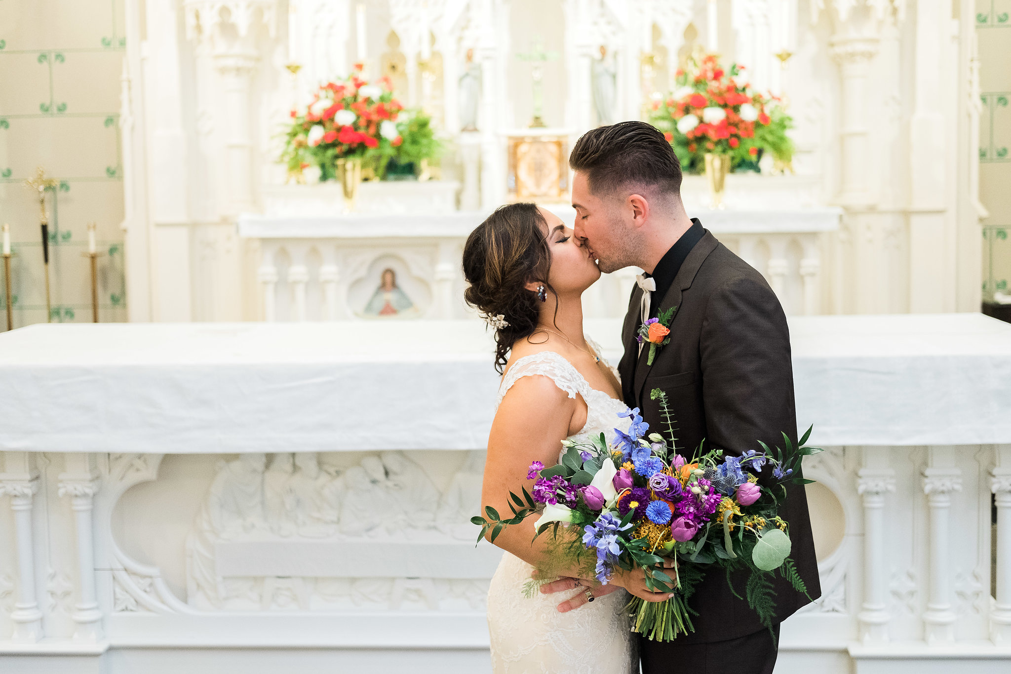 Bride and groom kissing at the wedding ceremony
