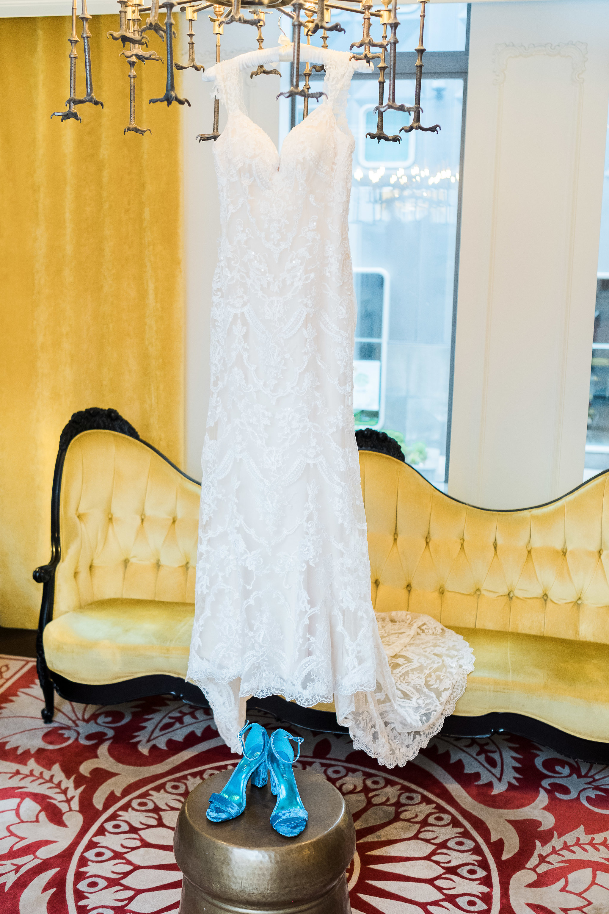 Bride's dress hanging in Hotel Monaco