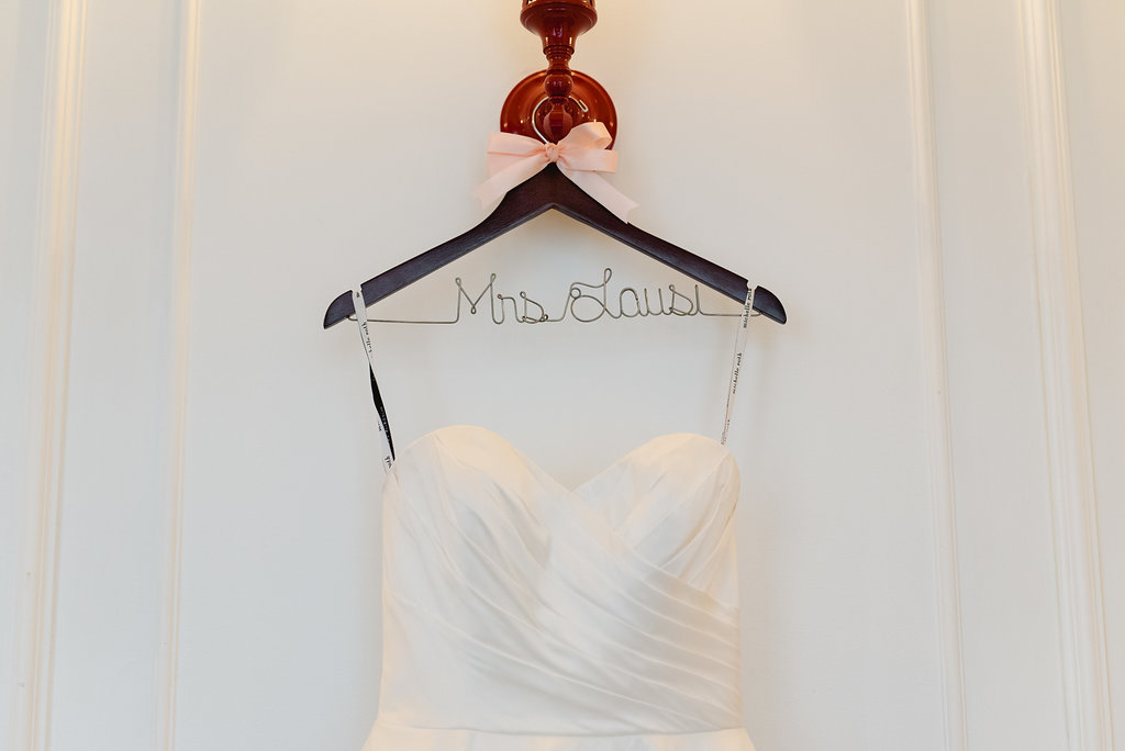 Wedding dress on name hanger for Pittsburgh wedding at Hotel Monaco