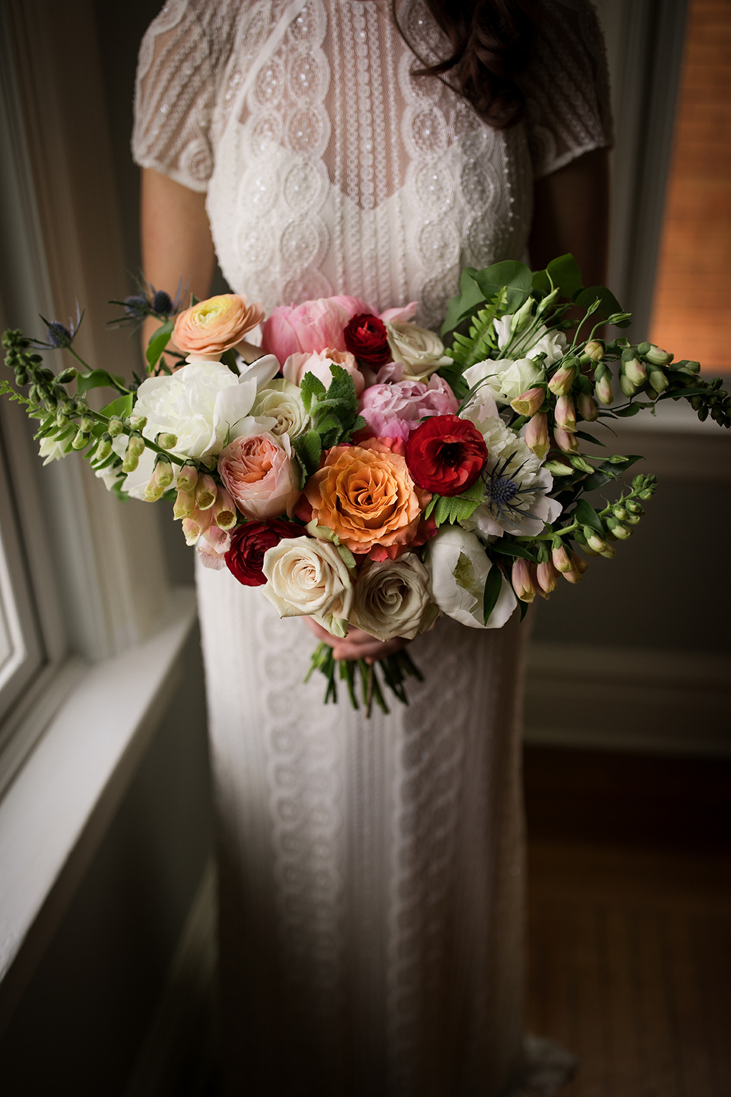 Bride in vintage style wedding gown and bird cage veil holding her wedding bouquet for Pittsburgh wedding at Ace Hotel. See more details at exhale-events.com!