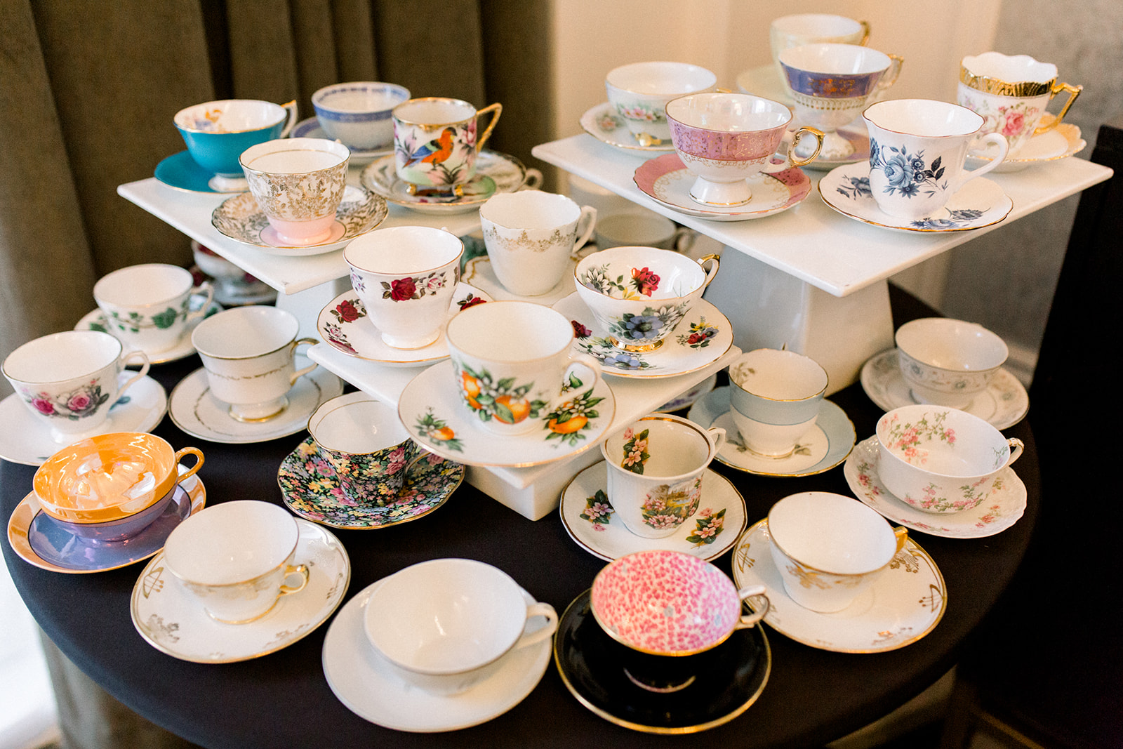 Vintage tea cups displayed at wedding reception for Pittsburgh wedding held at Hotel Monaco. See more beautiful details of this simple, yet stunning wedding at exhale-events.com!