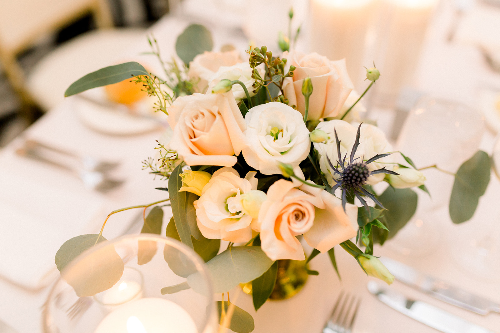 Wedding centerpieces with greenery and gold accents for Pittsburgh wedding held at Hotel Monaco. See more beautiful details of this simple, yet stunning wedding at exhale-events.com!