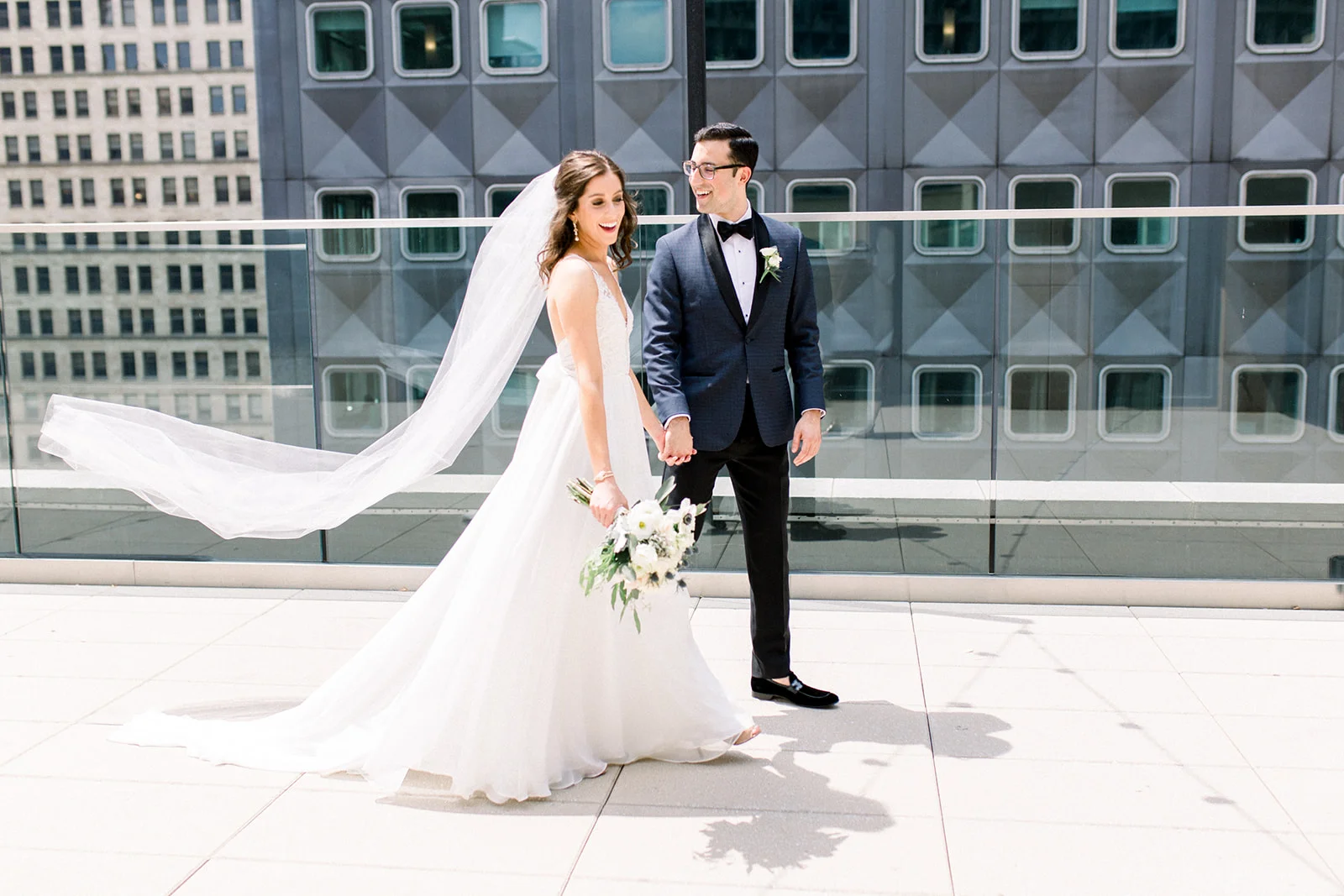 Bride and groom take wedding photos for Pittsburgh wedding held at Hotel Monaco. See more beautiful details of this simple, yet stunning wedding at exhale-events.com!