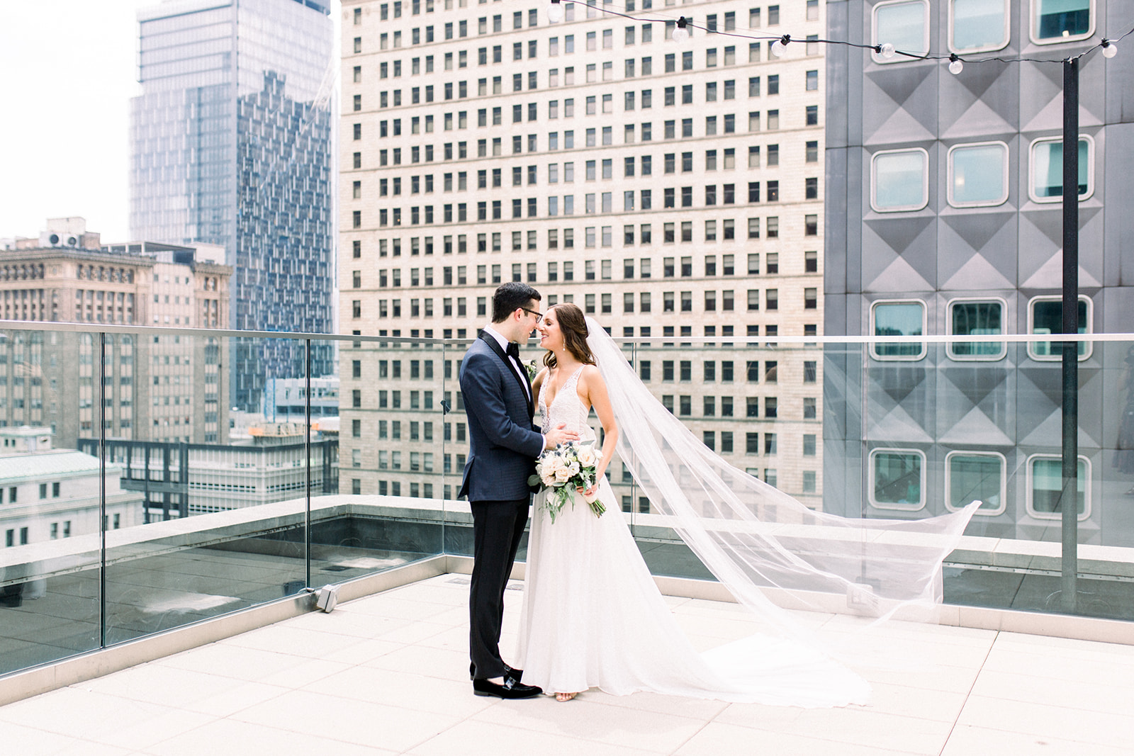 Bride and groom take wedding photos for Pittsburgh wedding held at Hotel Monaco. See more beautiful details of this simple, yet stunning wedding at exhale-events.com!