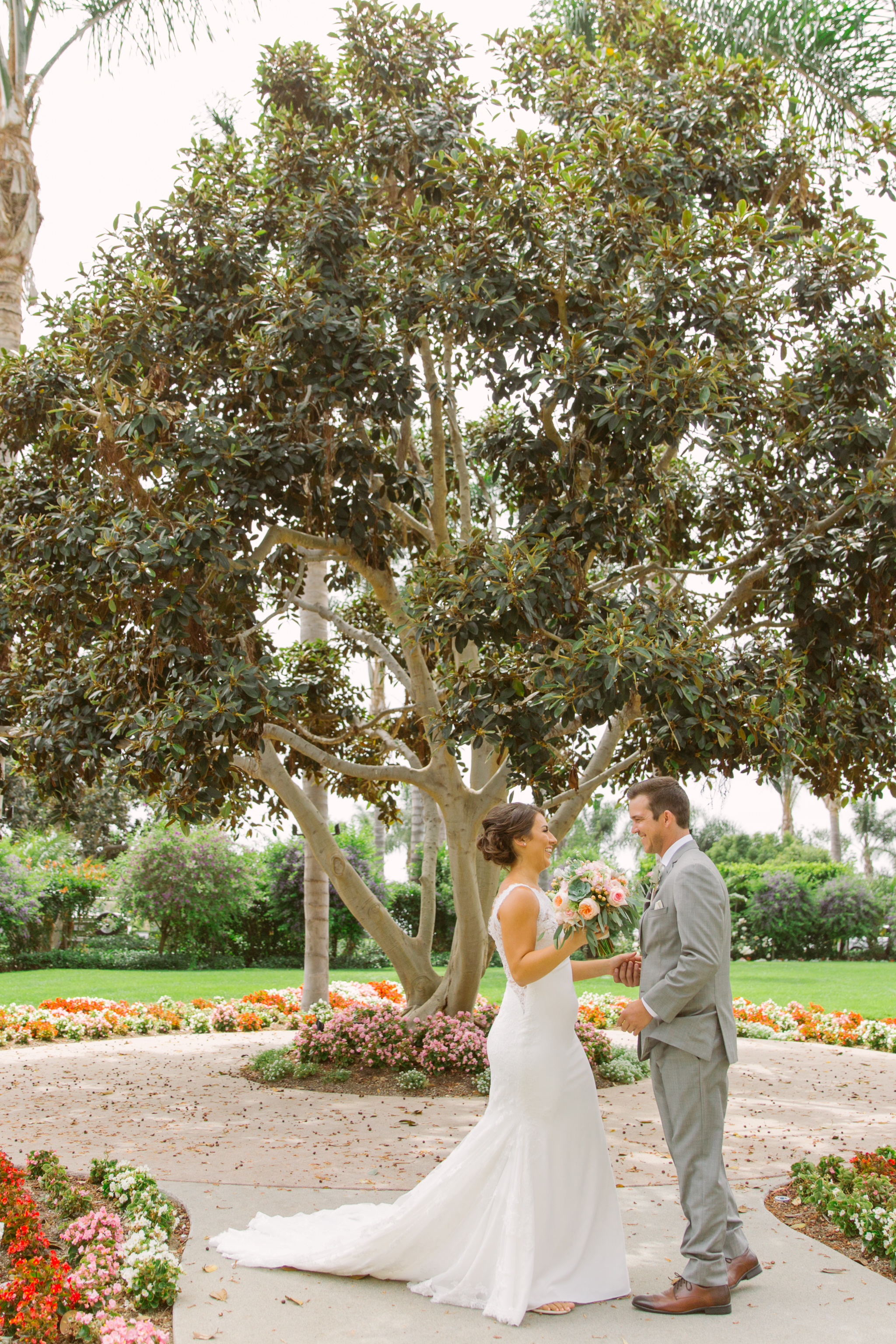 Bride and groom share a first look for San Diego, California outdoor wedding planned by Exhale Events. See all the beautiful details at exhale-events.com!