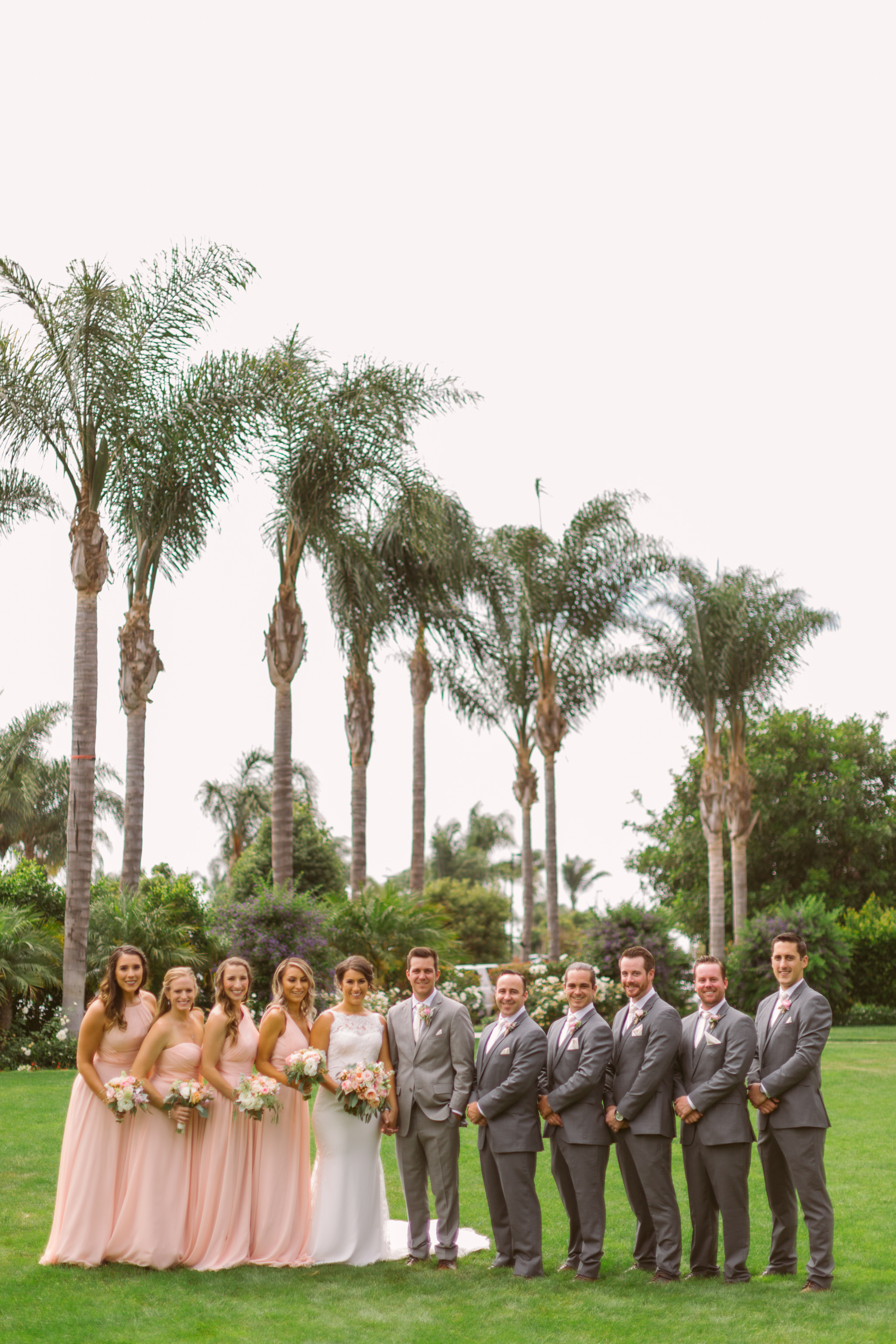 Wedding party taking wedding photos for San Diego, California outdoor wedding planned by Exhale Events. See all the beautiful details at exhale-events.com!