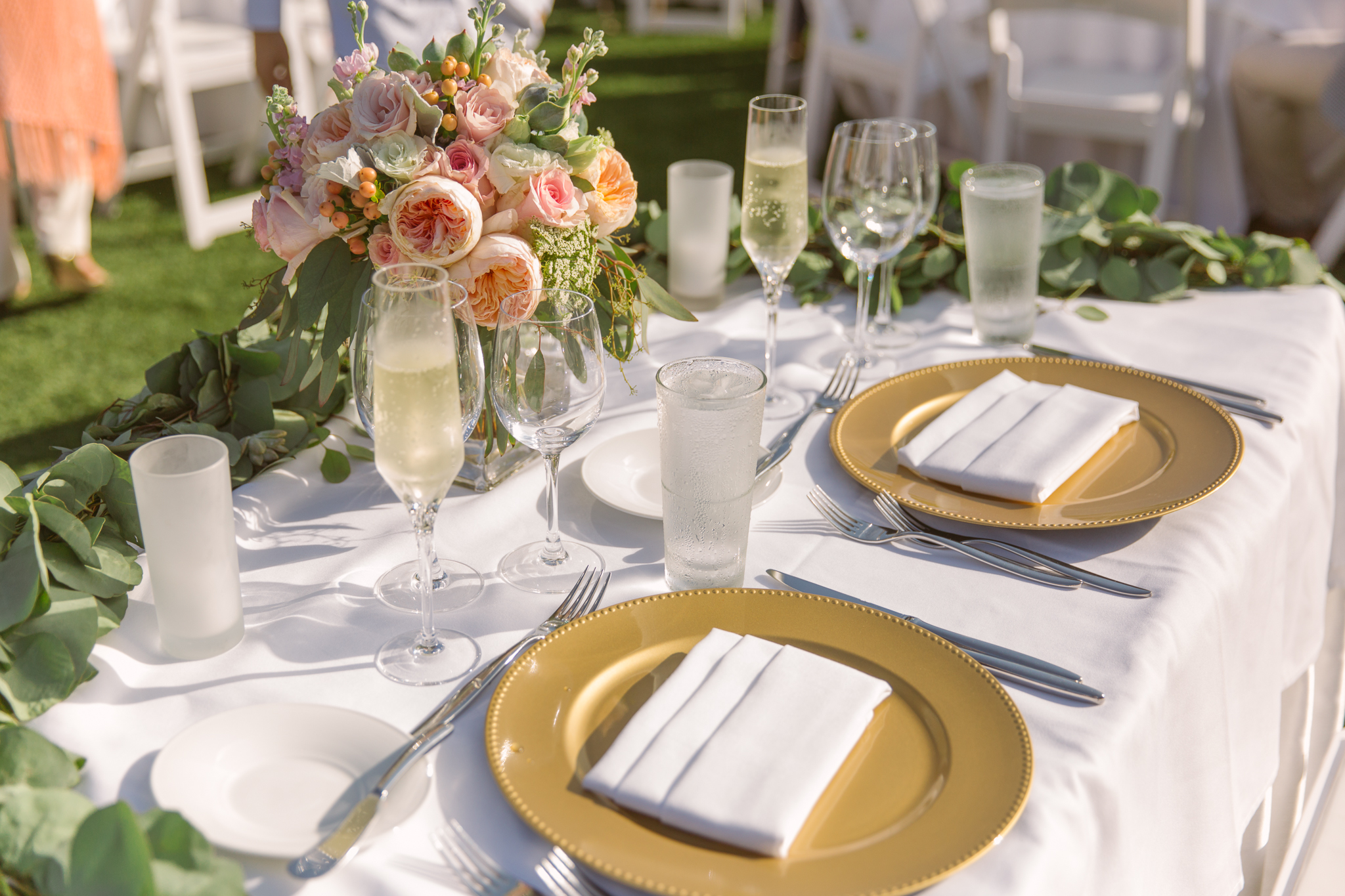 Wedding centerpieces for San Diego, California outdoor wedding planned by Exhale Events. See all the beautiful details at exhale-events.com!