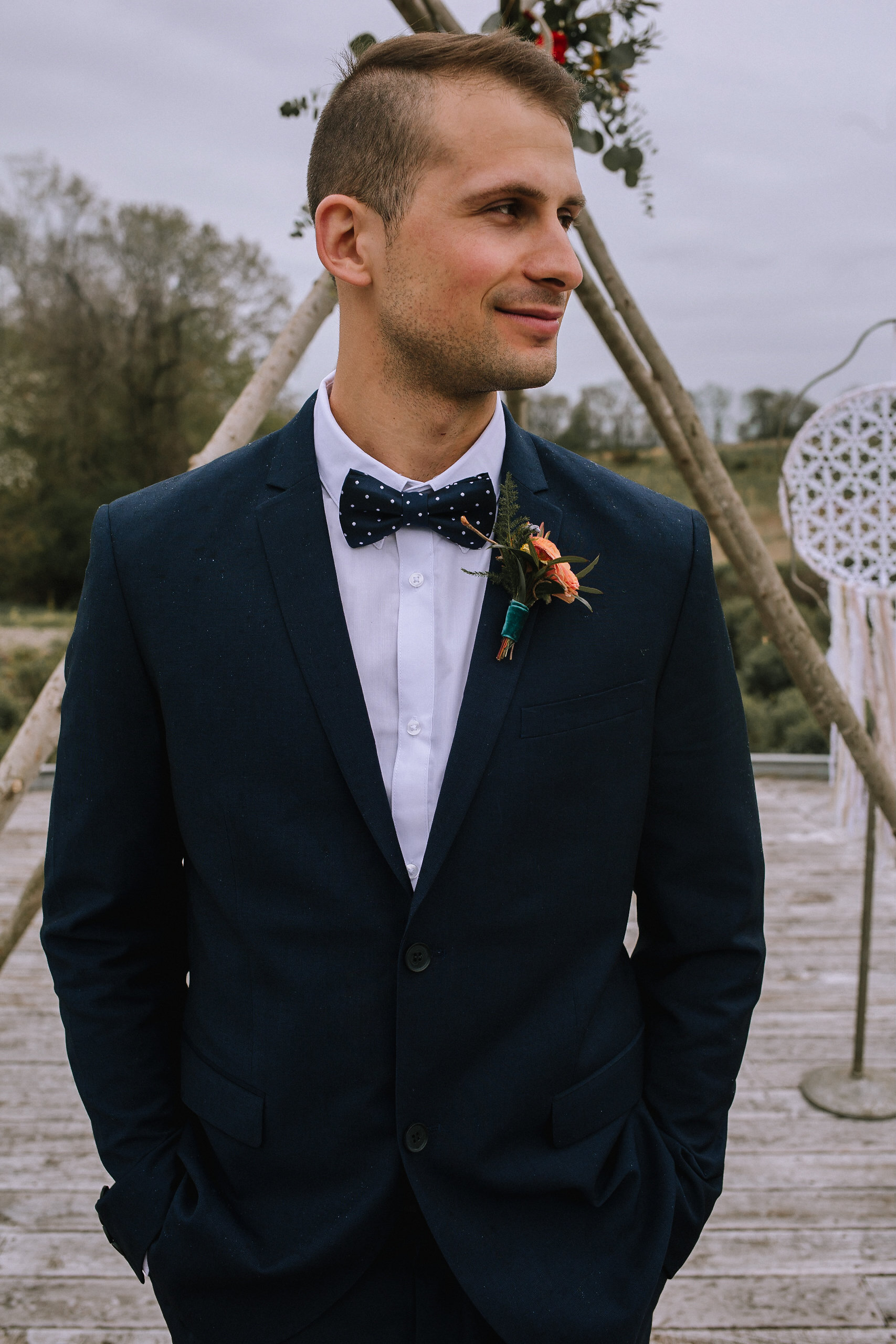 Grooms poses for wedding photos for fall vintage boho styled shoot designed by exhale events. Get inspired by these gorgeous wedding details at exhale-events.com!