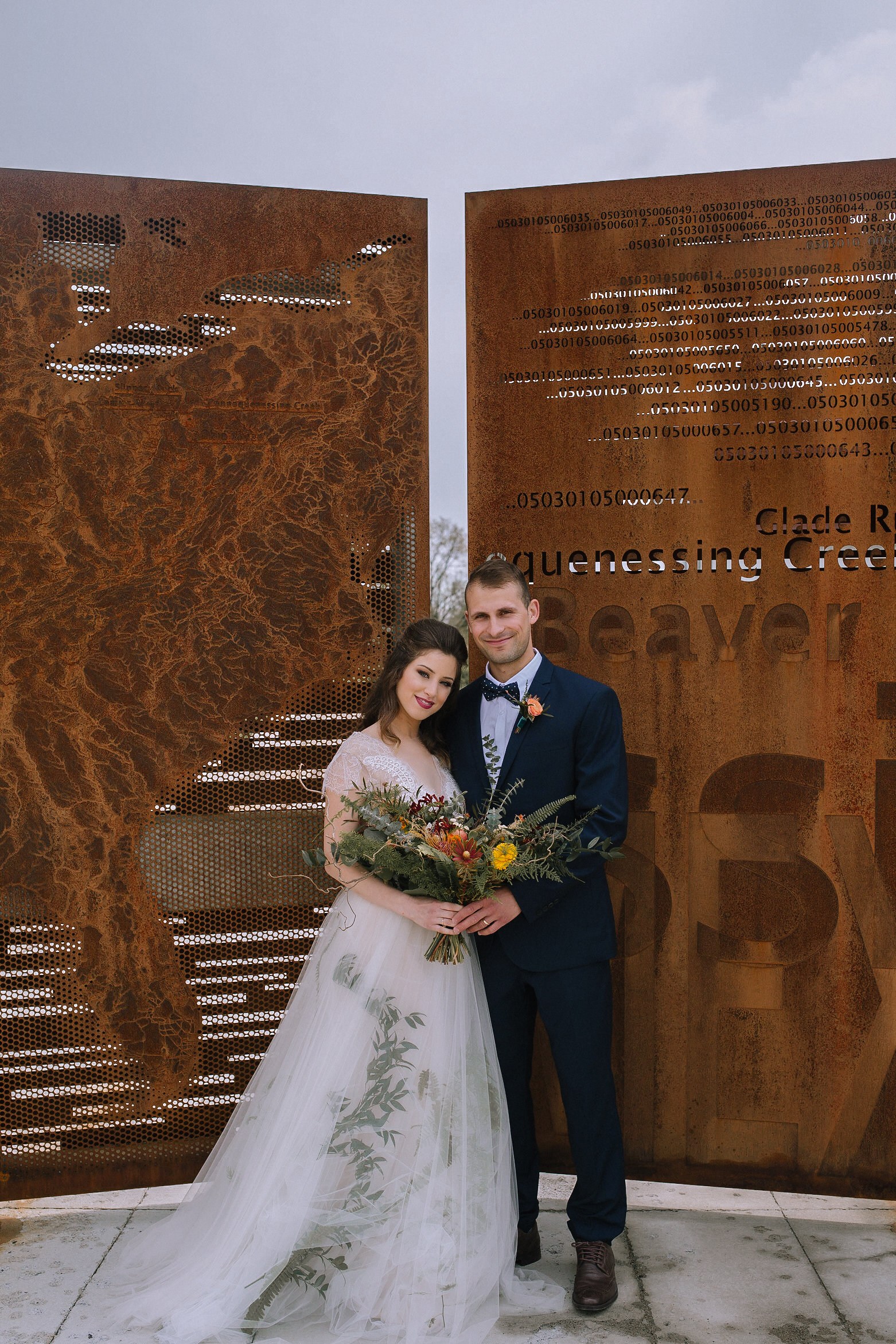 Boho bride and groom pose with wedding bouquet for fall vintage boho styled shoot designed by exhale events. Get inspired by these gorgeous wedding details at exhale-events.com!