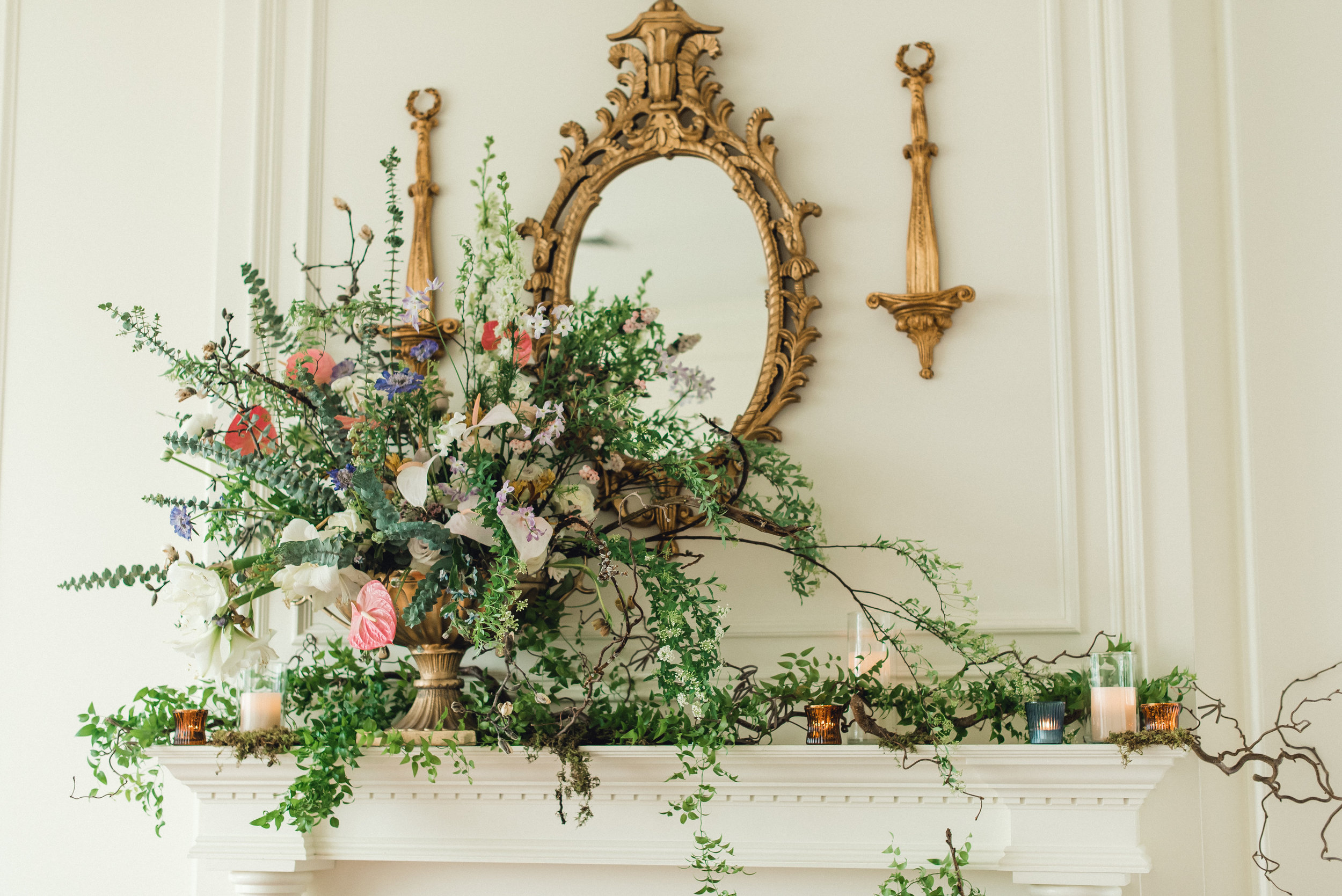 Mantel exploding with flowers at wedding venue for Pablo Neruda enchanting garden styled shoot planned by Exhale Events. Get inspired at exhale-events.com!