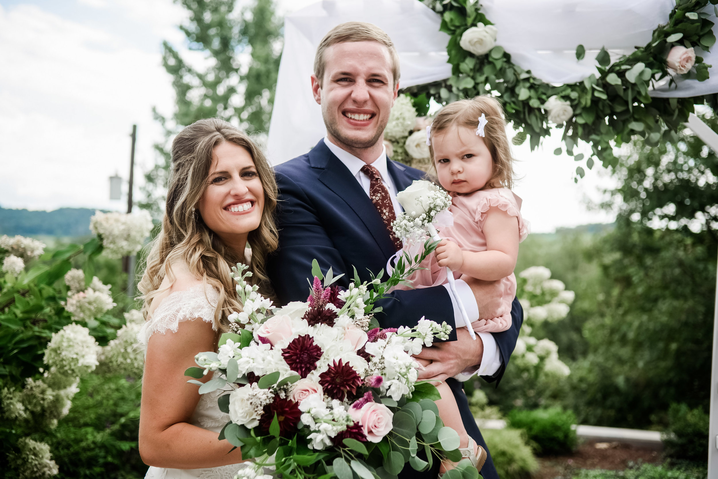 Bride and groom pose for outdoor wedding photos with family at Pittsburgh wedding planned by Exhale Events. Find more wedding inspiration at exhale-events.com!