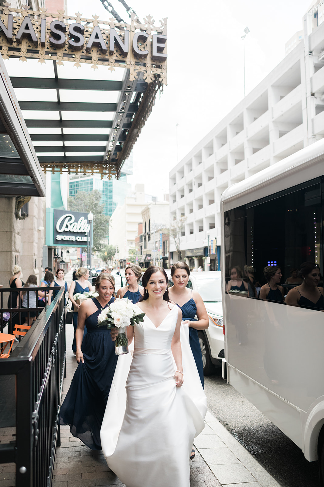 Bride and bridesmaids pose for wedding photos for Pittsburgh wedding at PNC Park planned by Exhale Events. Find more wedding inspiration at exhale-events.com!