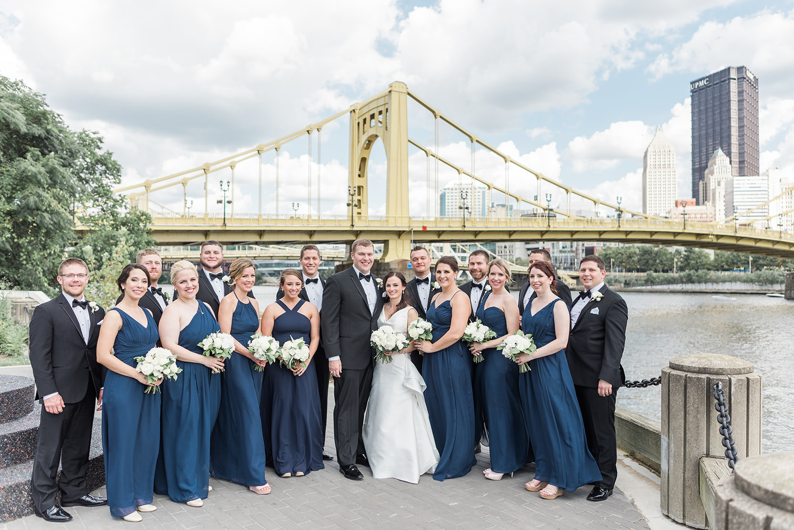 Wedding party poses for wedding photos for Pittsburgh wedding at PNC Park planned by Exhale Events. Find more wedding inspiration at exhale-events.com!