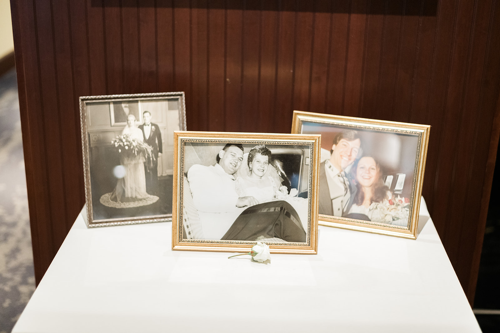 Family photographs displayed at wedding reception for Pittsburgh wedding at PNC Park planned by Exhale Events. Find more wedding inspiration at exhale-events.com!