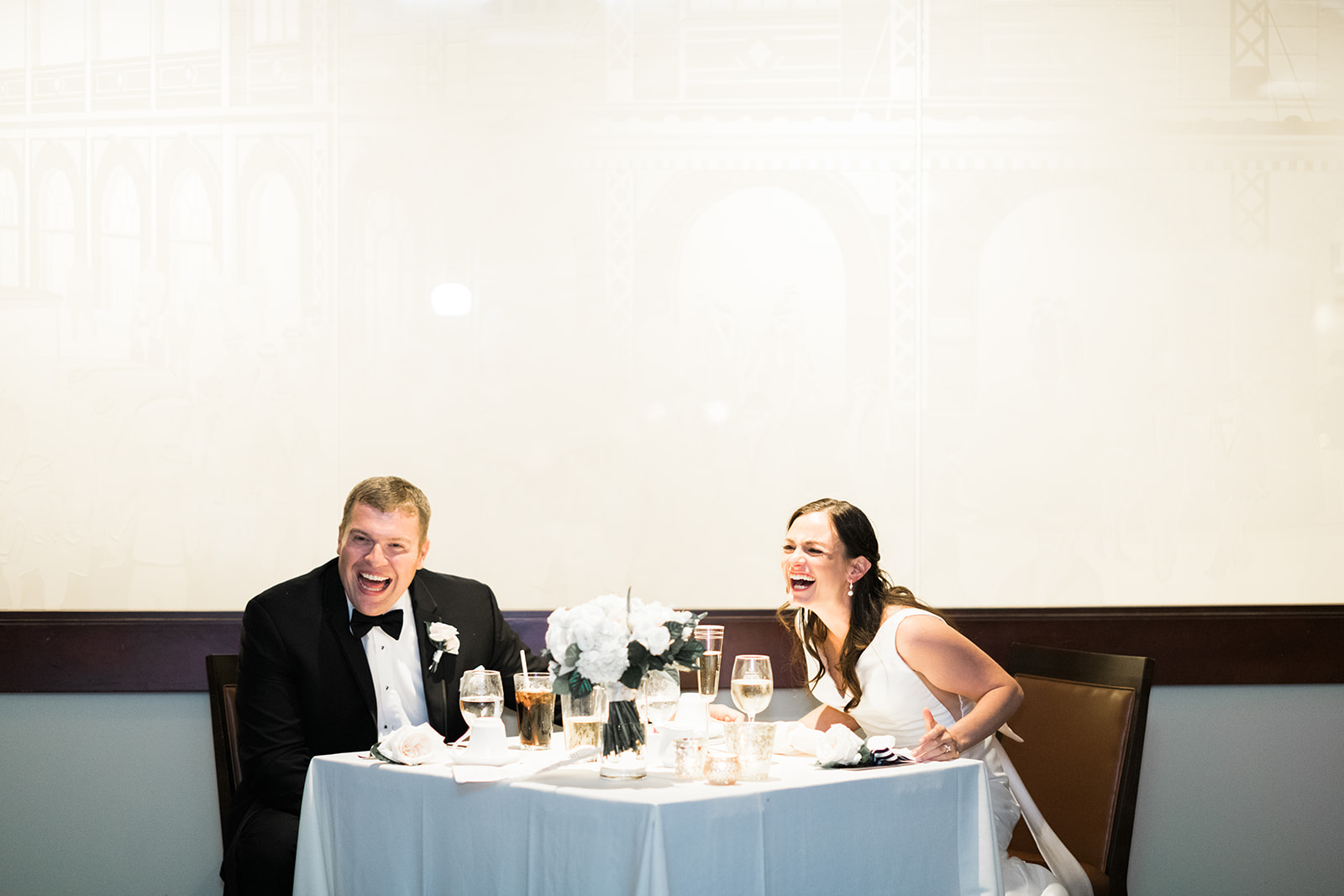 Bride and groom at wedding sweetheart table for Pittsburgh wedding at PNC Park planned by Exhale Events. Find more wedding inspiration at exhale-events.com!