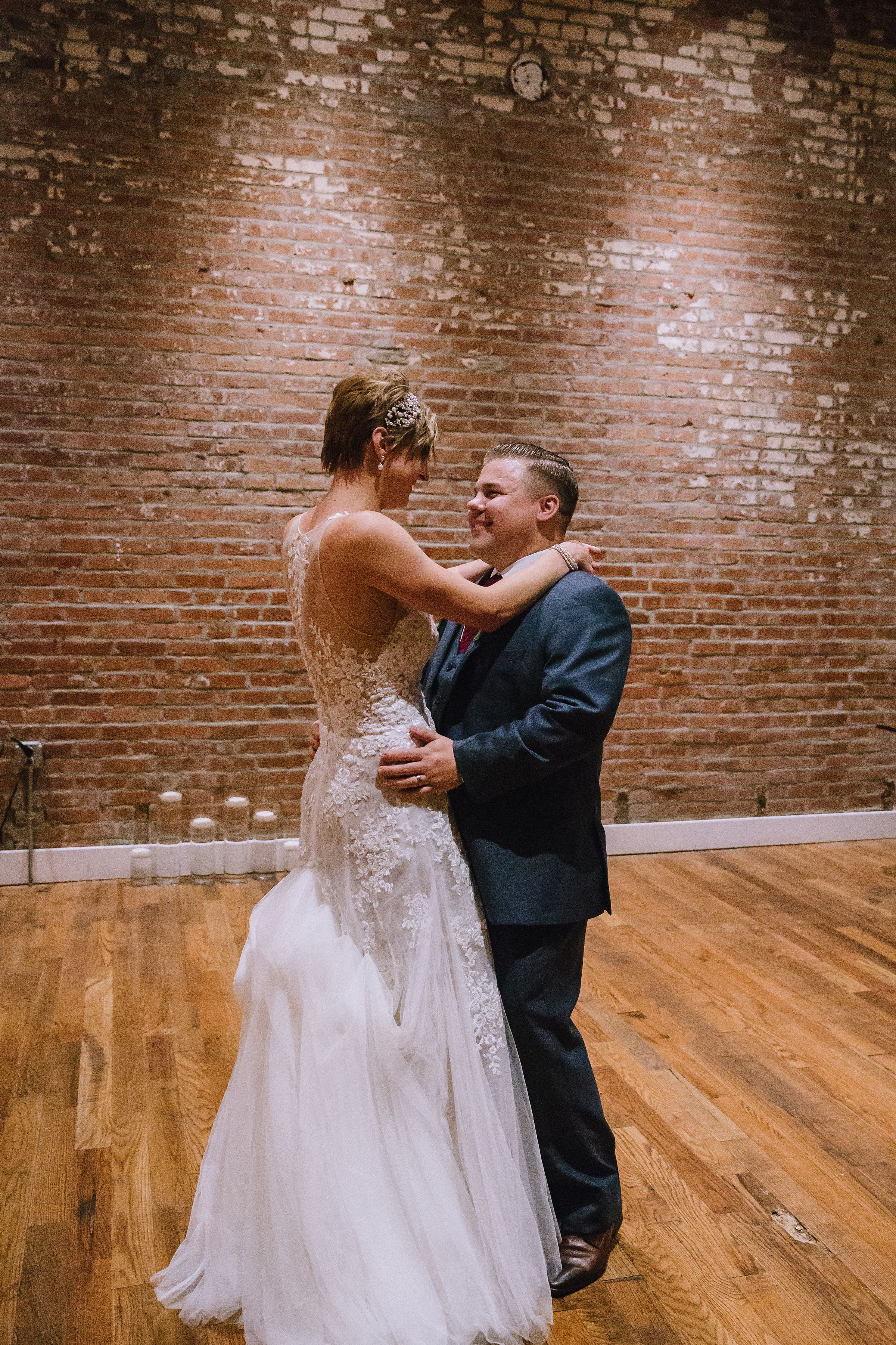 Bride and groom share first dance at Pittsburgh wedding at Studio Slate planned by Exhale Events. Find more wedding inspiration at exhale-events.com!