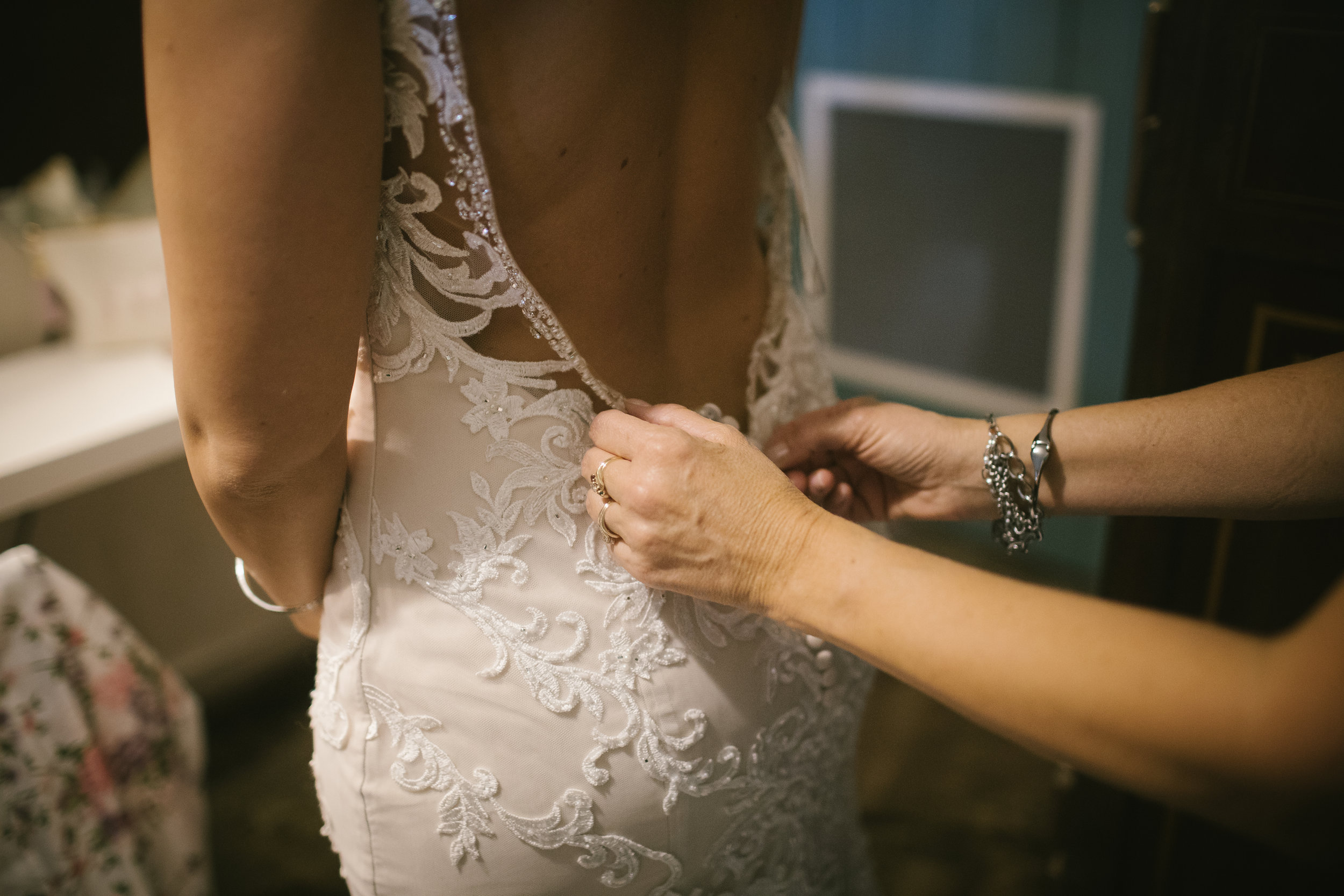 Bride's embellished lace wedding dress for rustic wedding in Pittsburgh, PA planned by Exhale Events. Find more wedding inspiration at exhale-events.com!