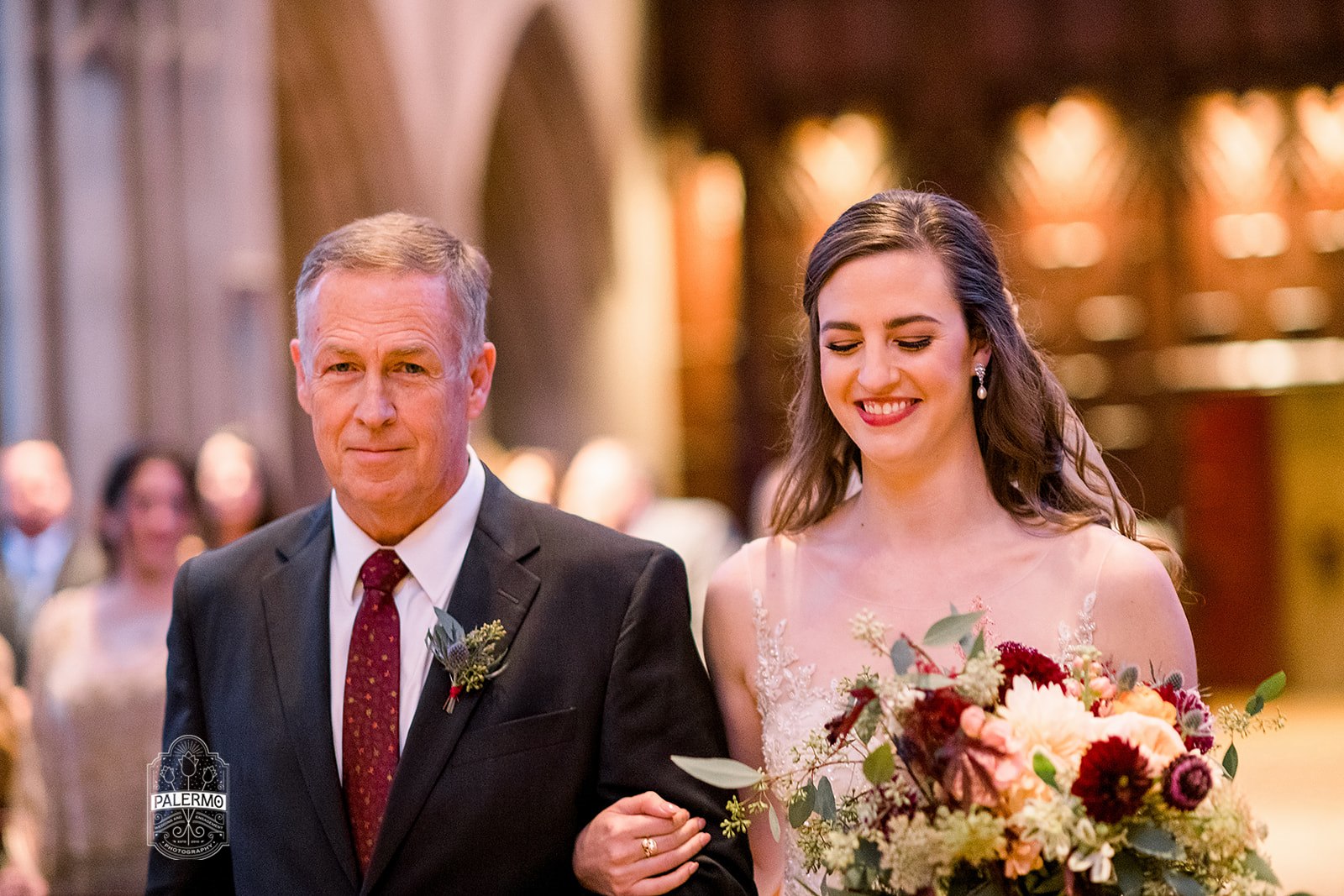 Bride walking down the aisle during wedding ceremony at Heinz Chapel in Pittsburgh, PA planned by Exhale Events. Find more wedding inspiration at exhale-events.com!
