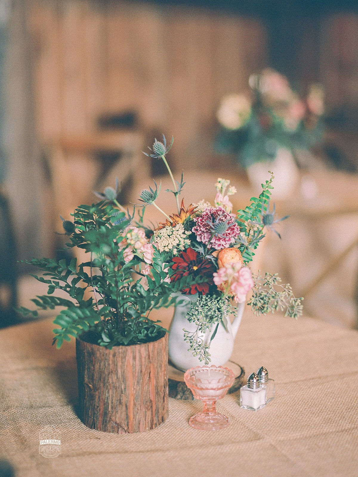 Wedding centerpieces and table settings for rustic fall barn wedding in Pittsburgh, PA planned by Exhale Events. Find more wedding inspiration at exhale-events.com!