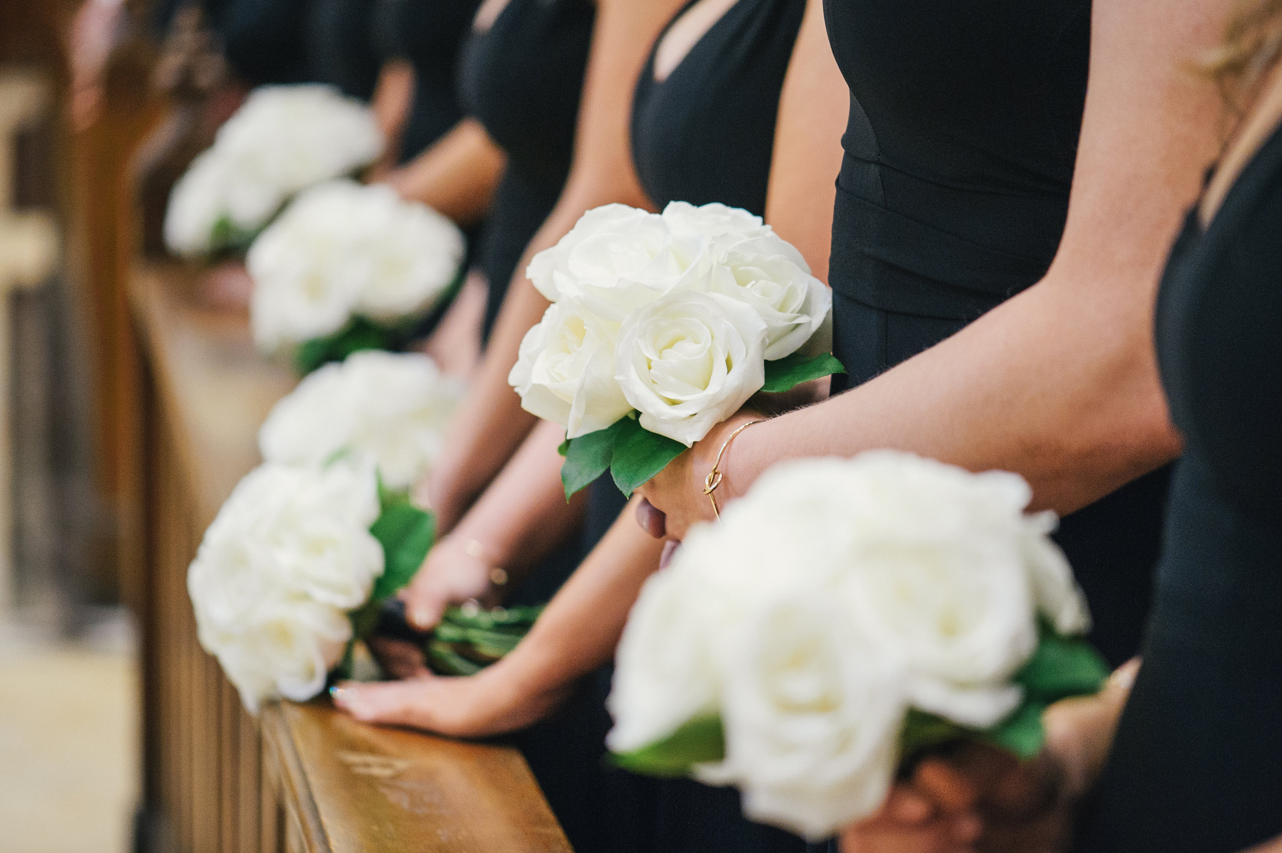 White wedding bouquets for black, white, and gold wedding in Buffalo, NY planned by Exhale Events. Find more wedding inspiration at exhale-events.com!